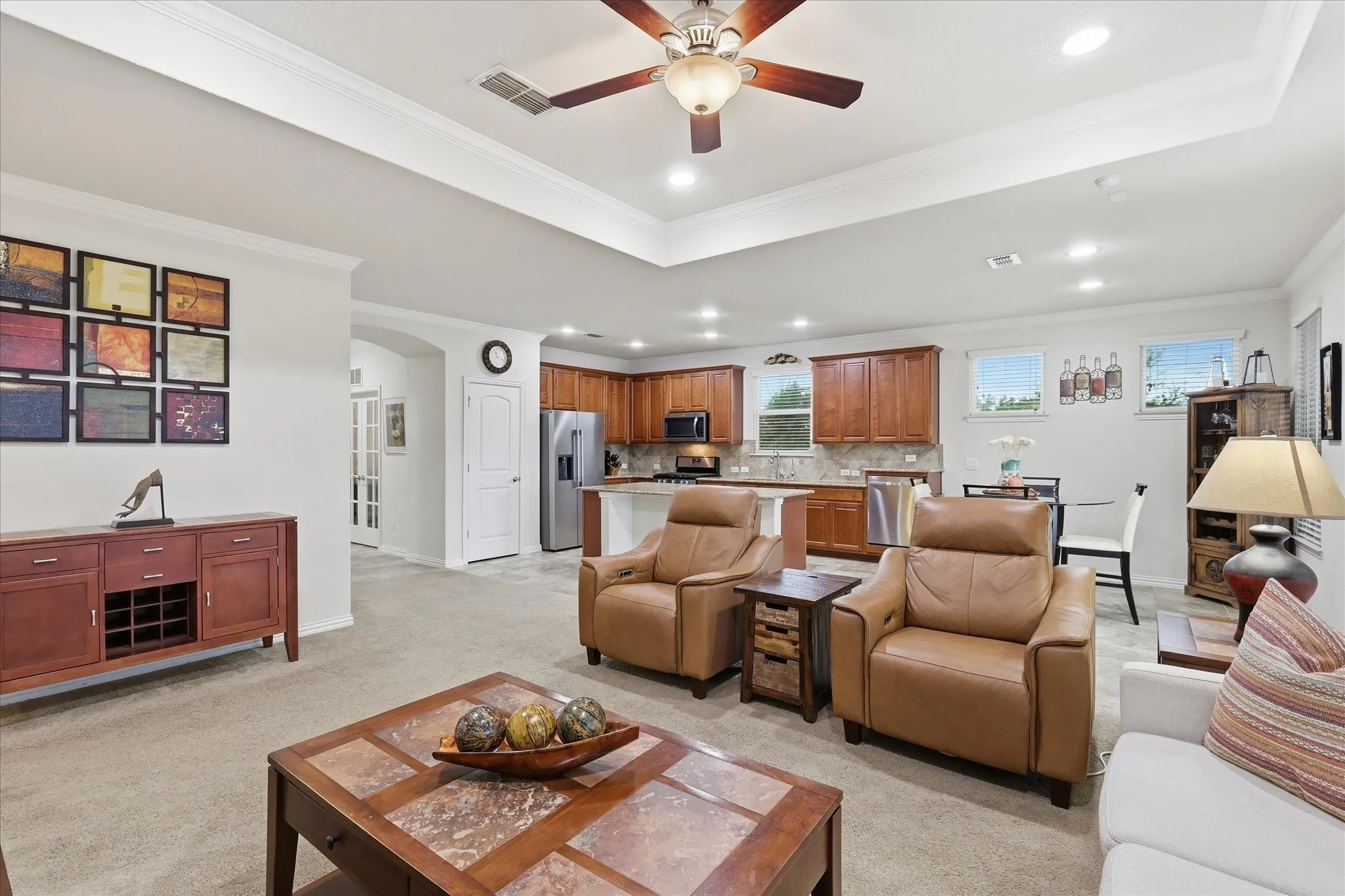 Open-concept interior featuring access to Kitchen and Dining Room