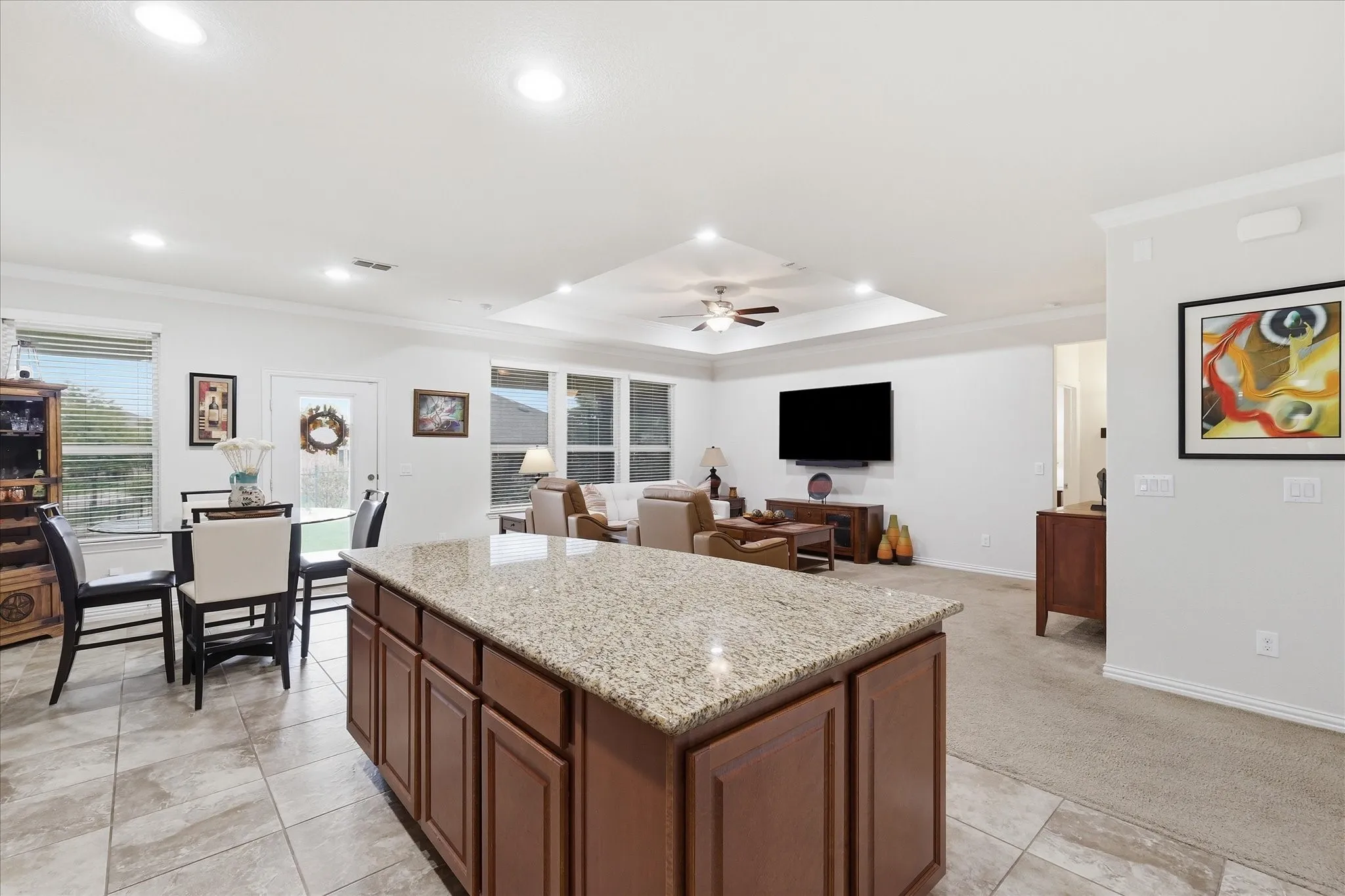 Kitchen featuring a central island with additional storage cabinets