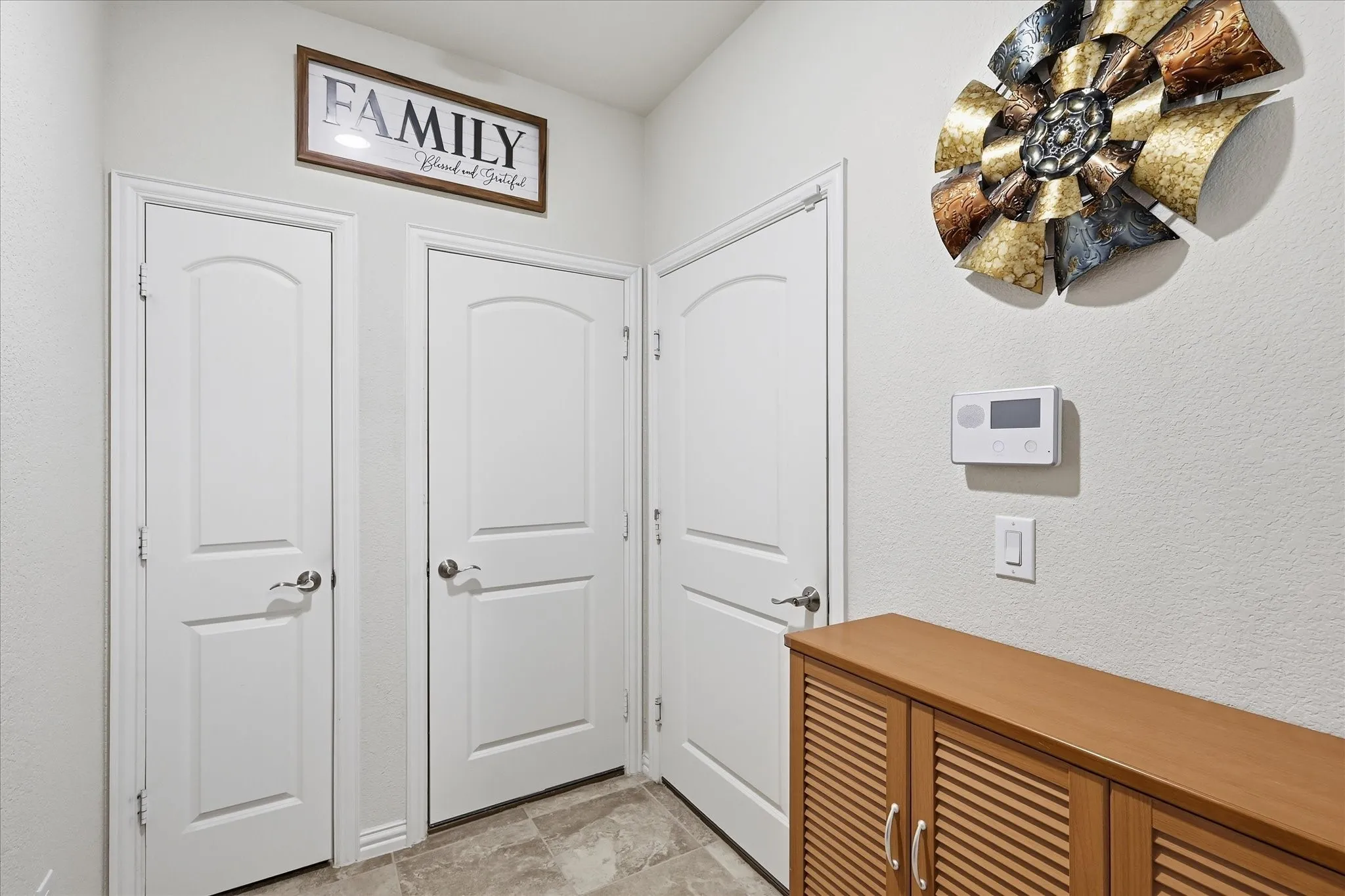 Mud Room has built in cabinet, coat closet and access to garage