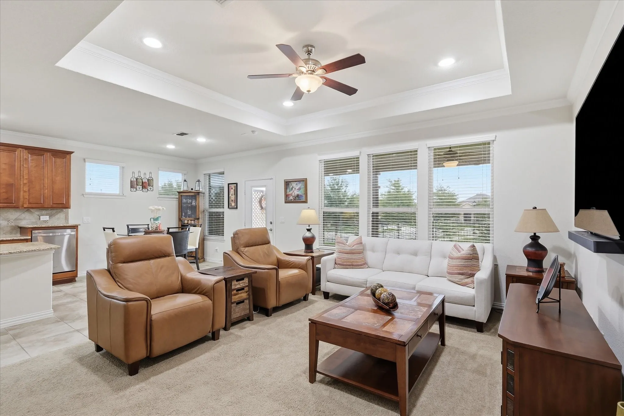 Living Room has a beautiful view of backyard and extended patio