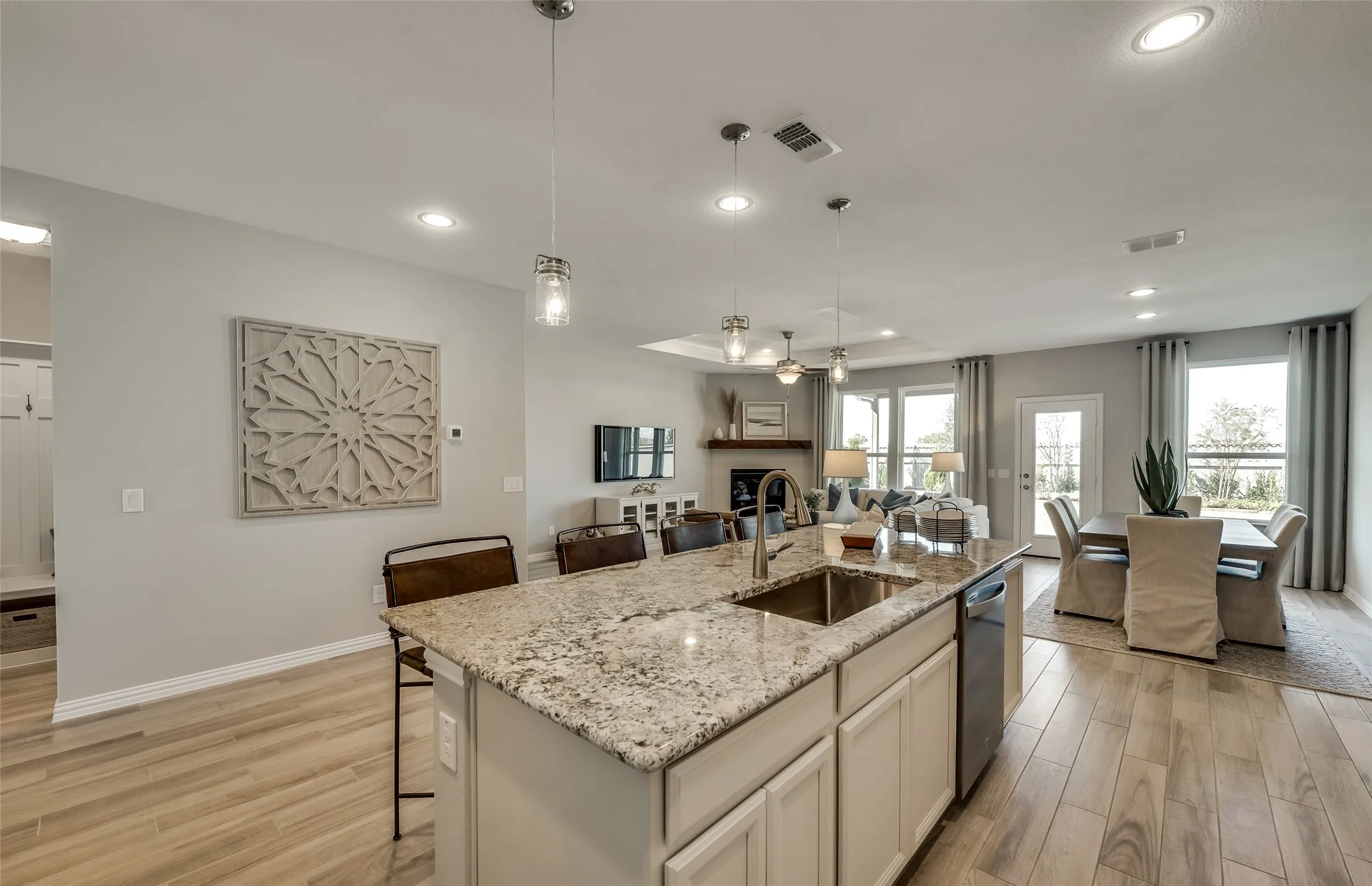 *Model Representation - Large island gathering room and dining areas overlooking