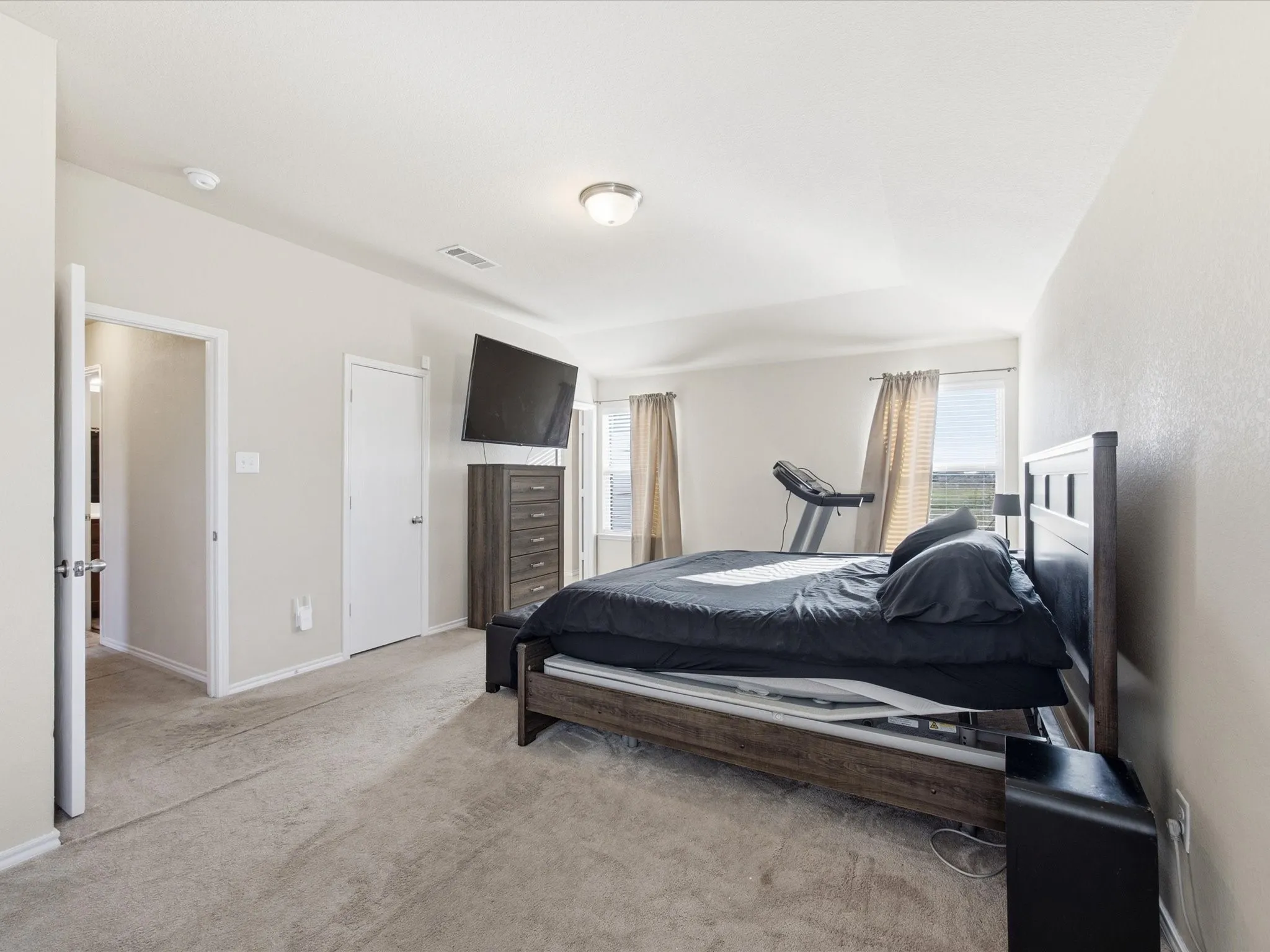 Primary bedroom featuring 2 closets
