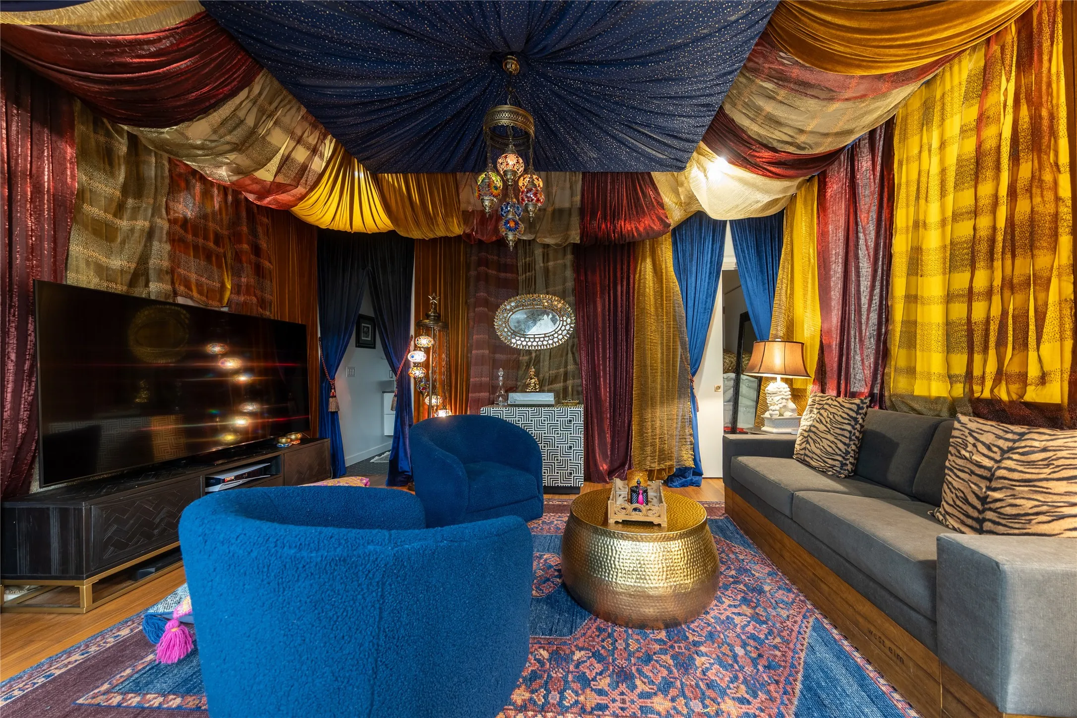 This bedroom off the studio has been finished with a Moroccan theme, evoking the inside of a Genie's bottle.