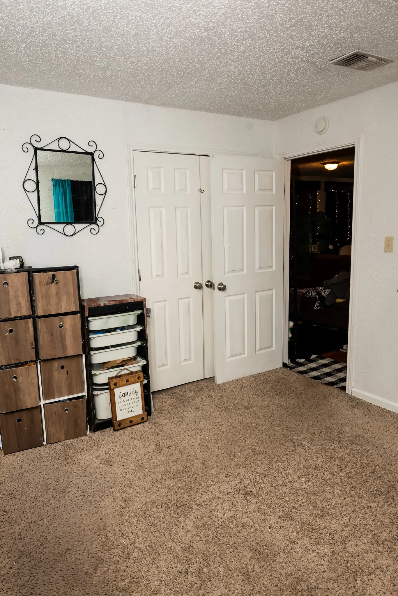 Neutral carpeting and dual white-panel interior doors