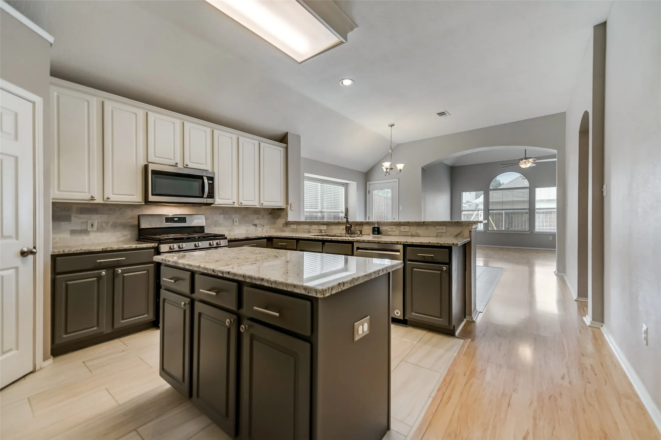 From kitchen looking out to adjacent spacious breakfast area and 2nd living room