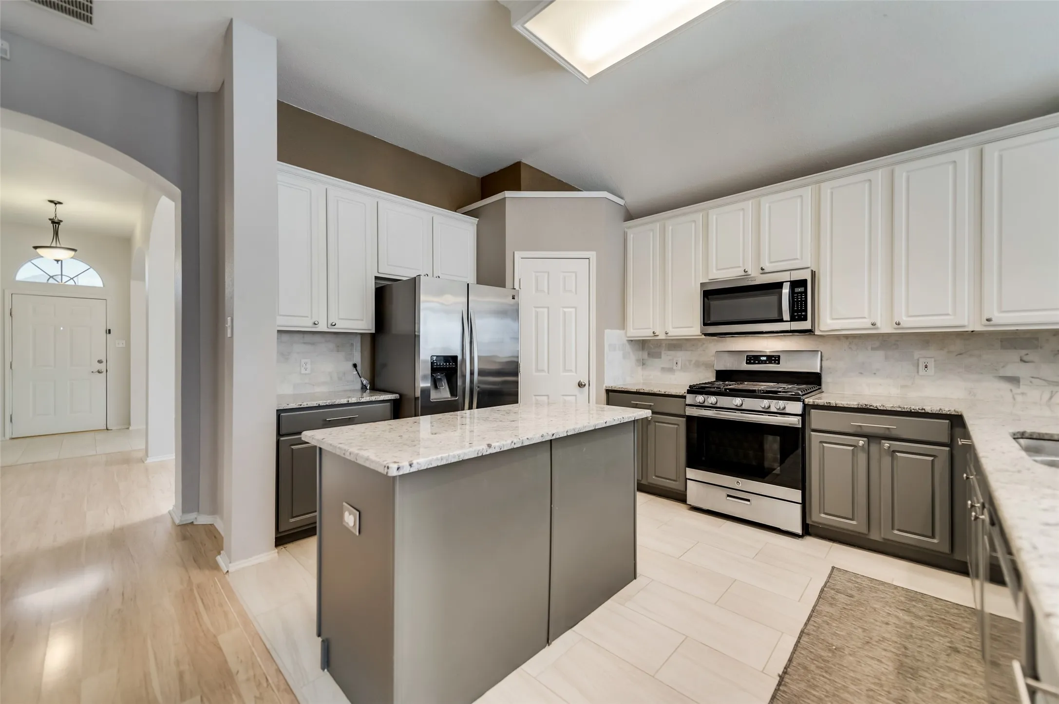Beautiful classy granite counter tops with designer elite back splash with island