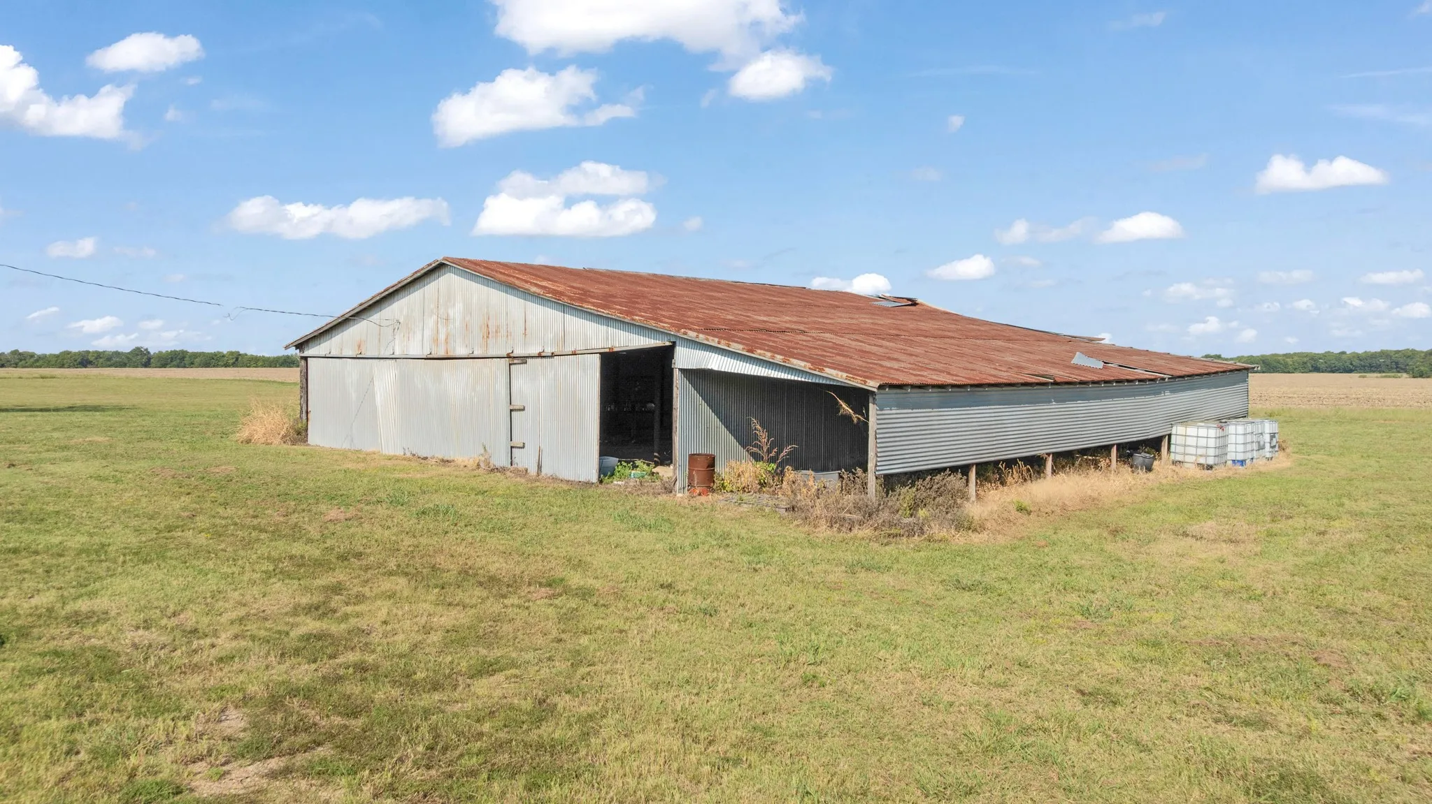 View of pole building featuring a yard and a view of countryside