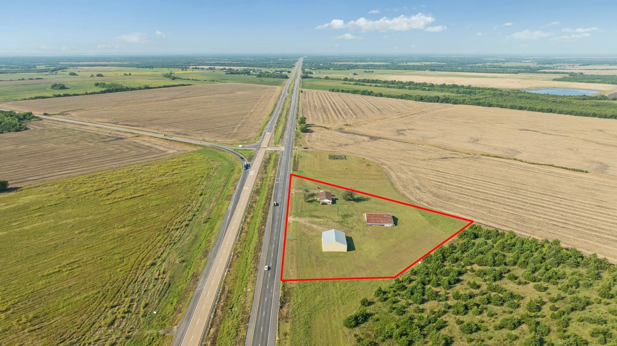 Aerial view of sparsely populated area with abundant farmland and property boundaries highlighted