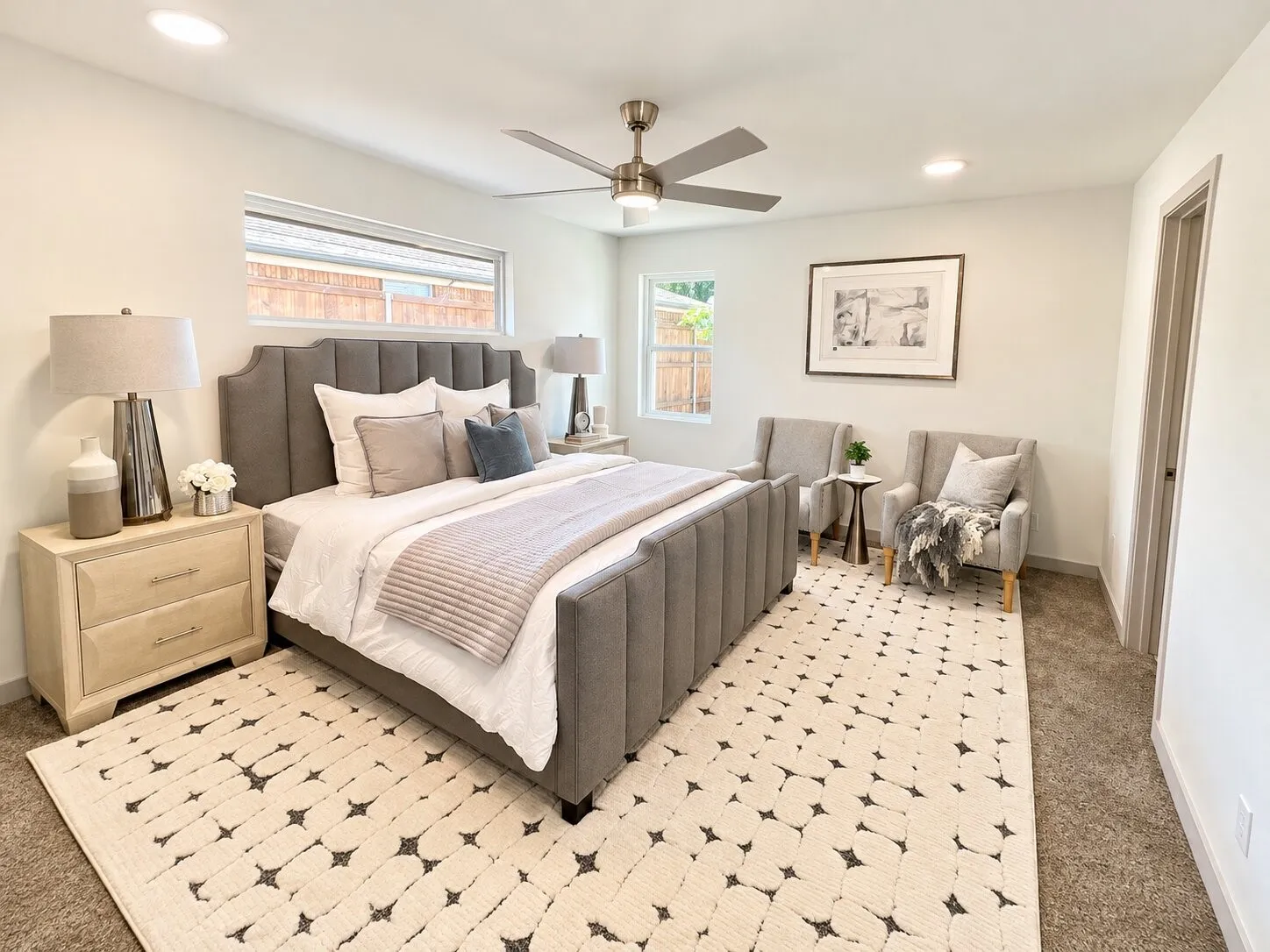 Neutral-toned room featuring recessed lighting, a brushed-nickel ceiling fan, and carpeted flooring