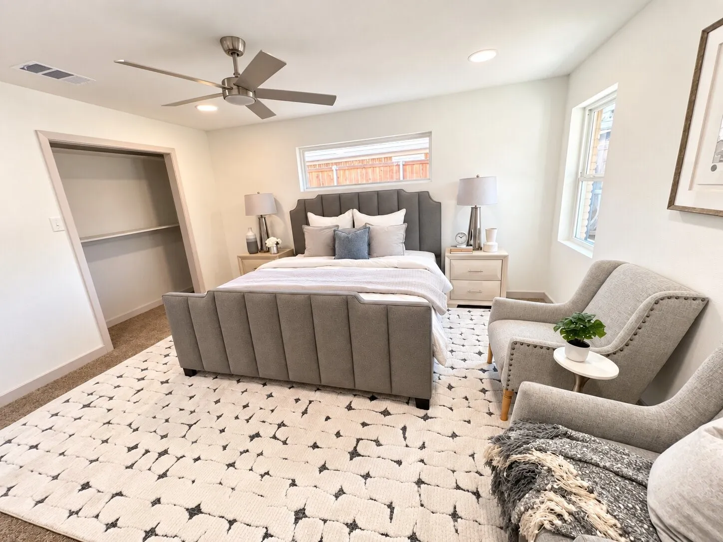 Bedroom featuring neutral carpet flooring, recessed lighting, ceiling fan with integrated lighting, and horizontal windows