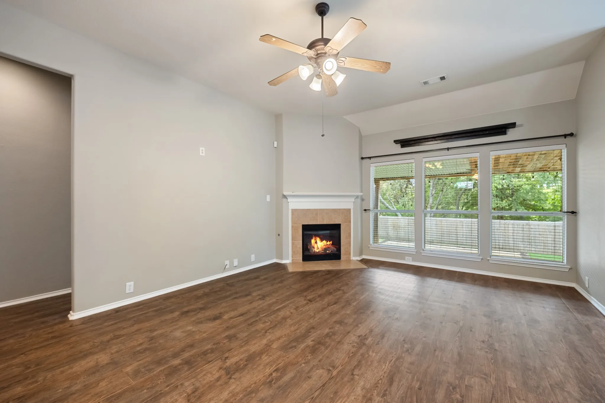 Living room with fireplace and outdoor views