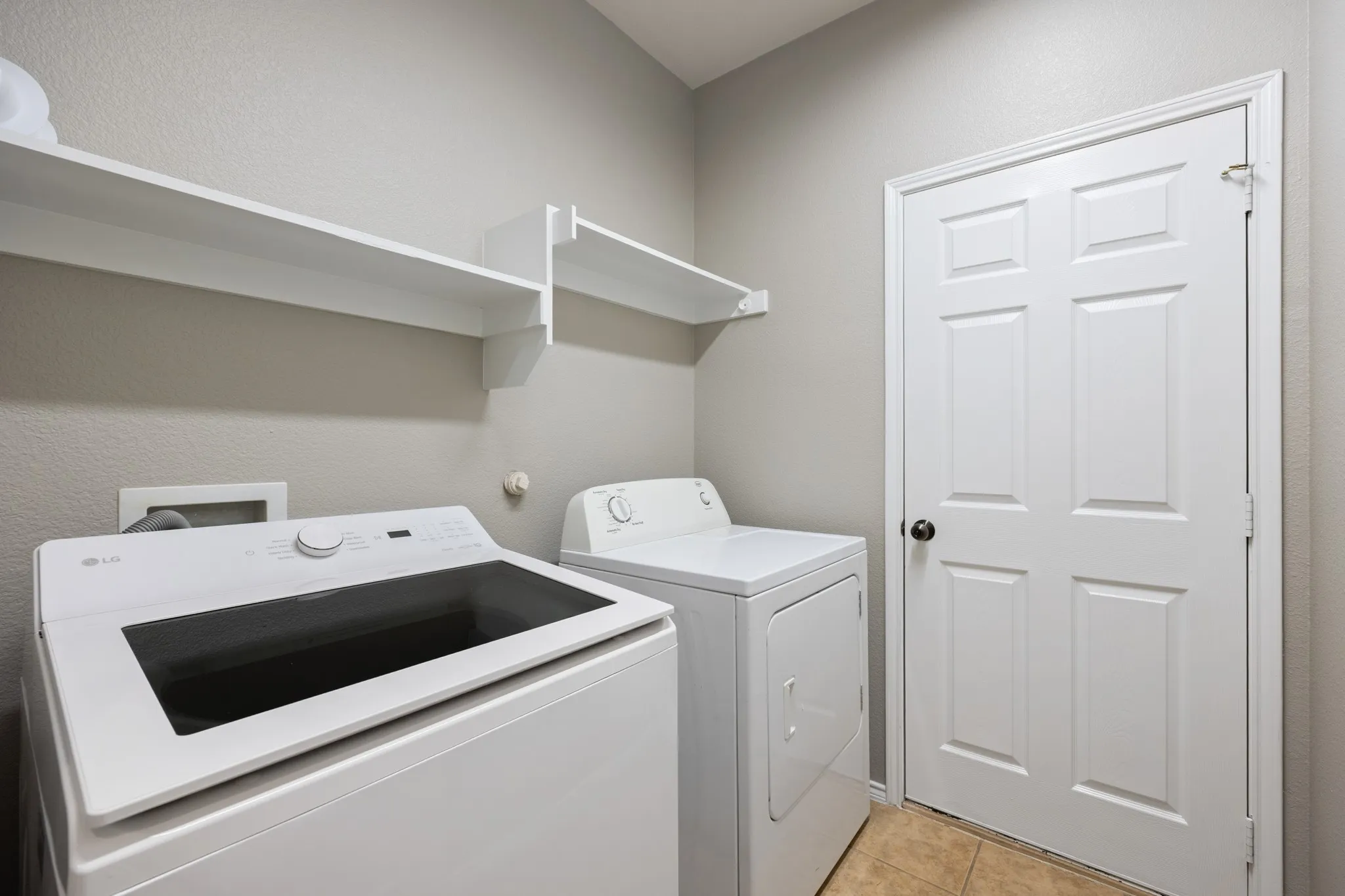 Utility room with washer and dryer