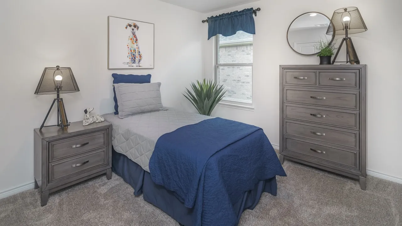 Carpeted interior space featuring a window with a valance, light-toned walls, and a visible window frame