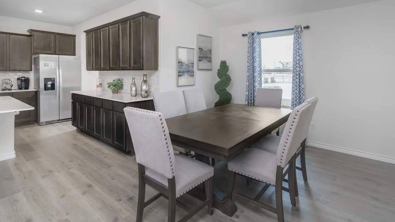 Open concept dining area featuring light wood-finish flooring