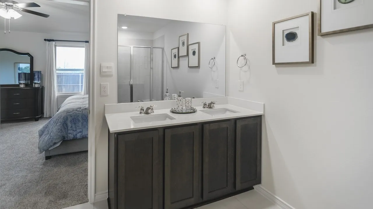 Dual vanity with rectangular undermount sinks and a light-toned countertop