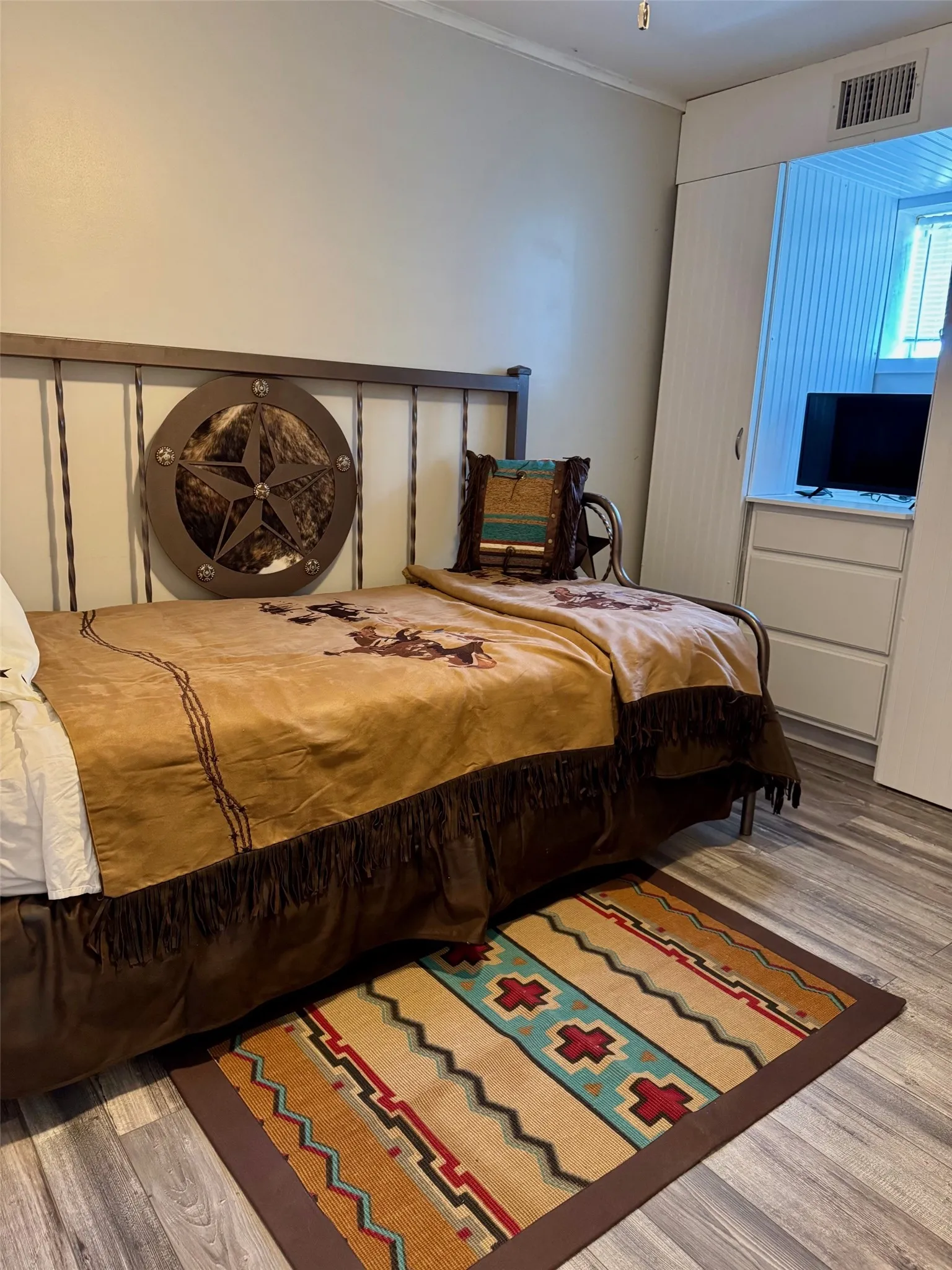 Bedroom featuring wood finished floors