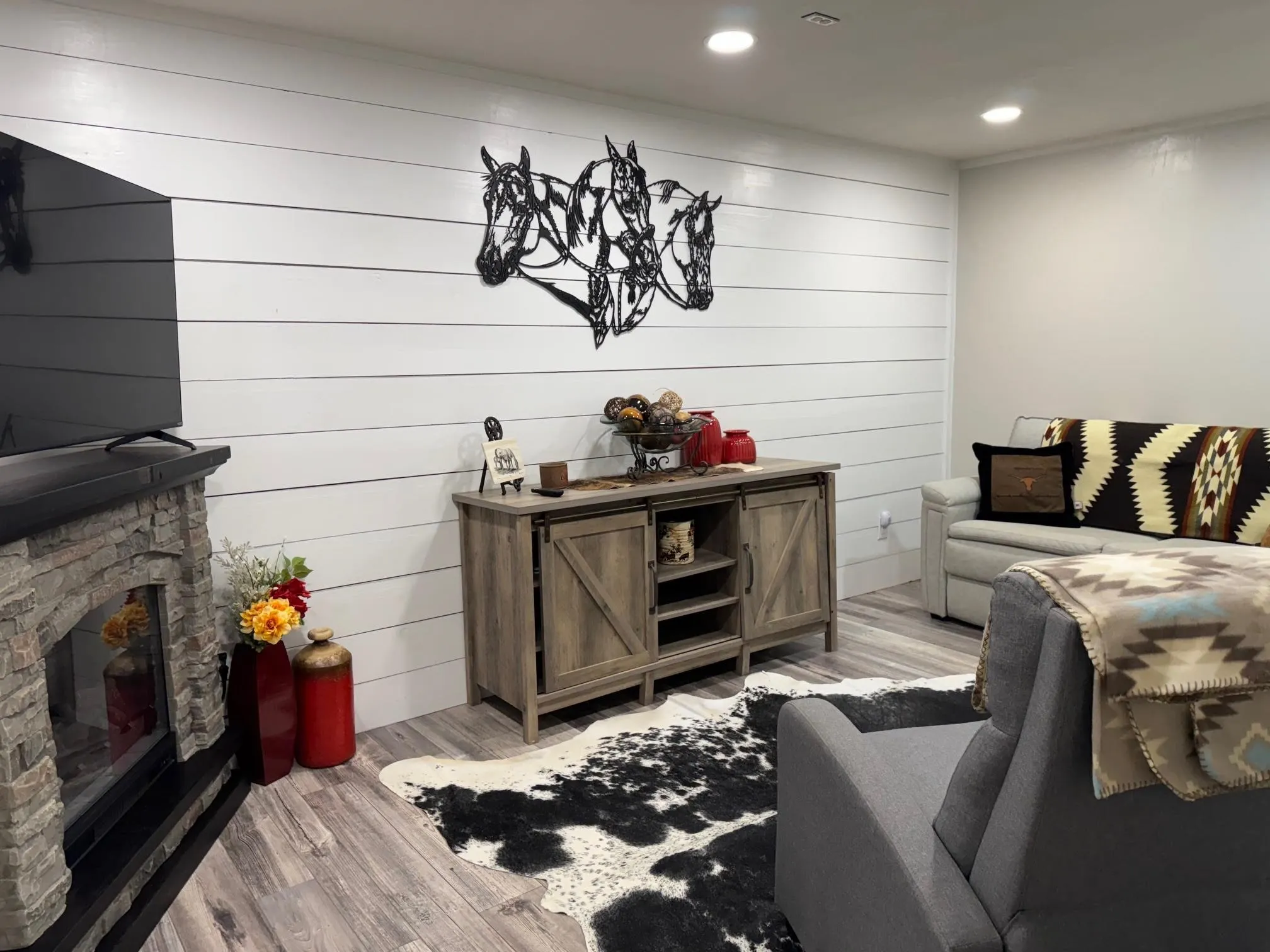 Living area featuring wood finished floors, a fireplace, and recessed lighting