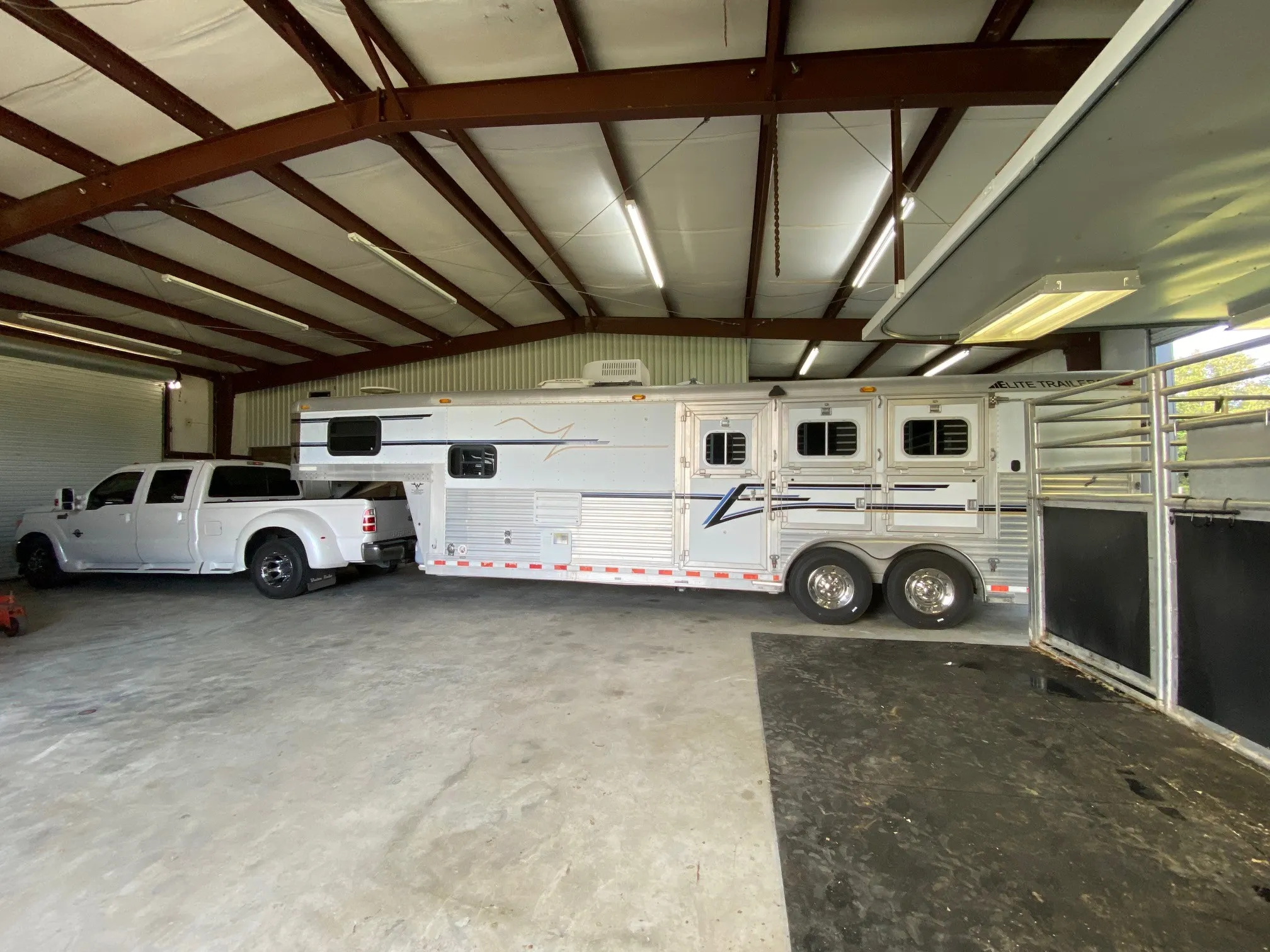 Trailer and truck fit in middle of barn with 50 Amp hookup