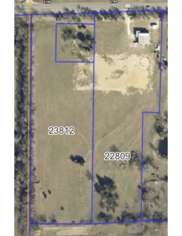 Aerial overview of property's location featuring property boundaries highlighted.