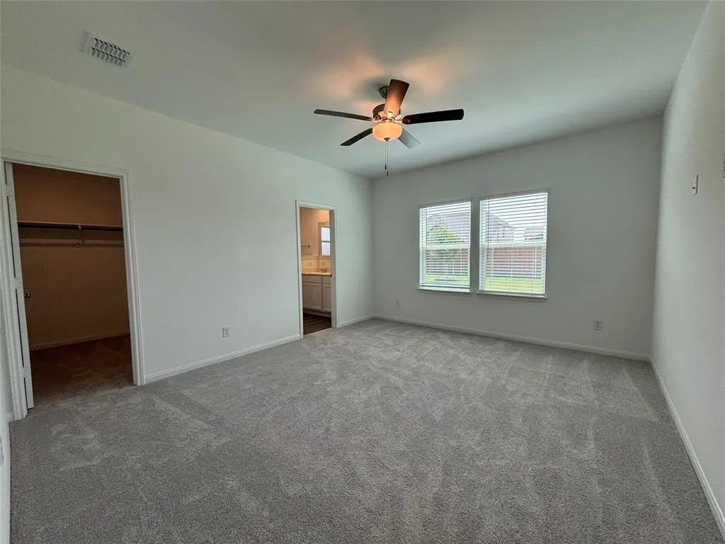 Large primary bed with lovely views of backyard