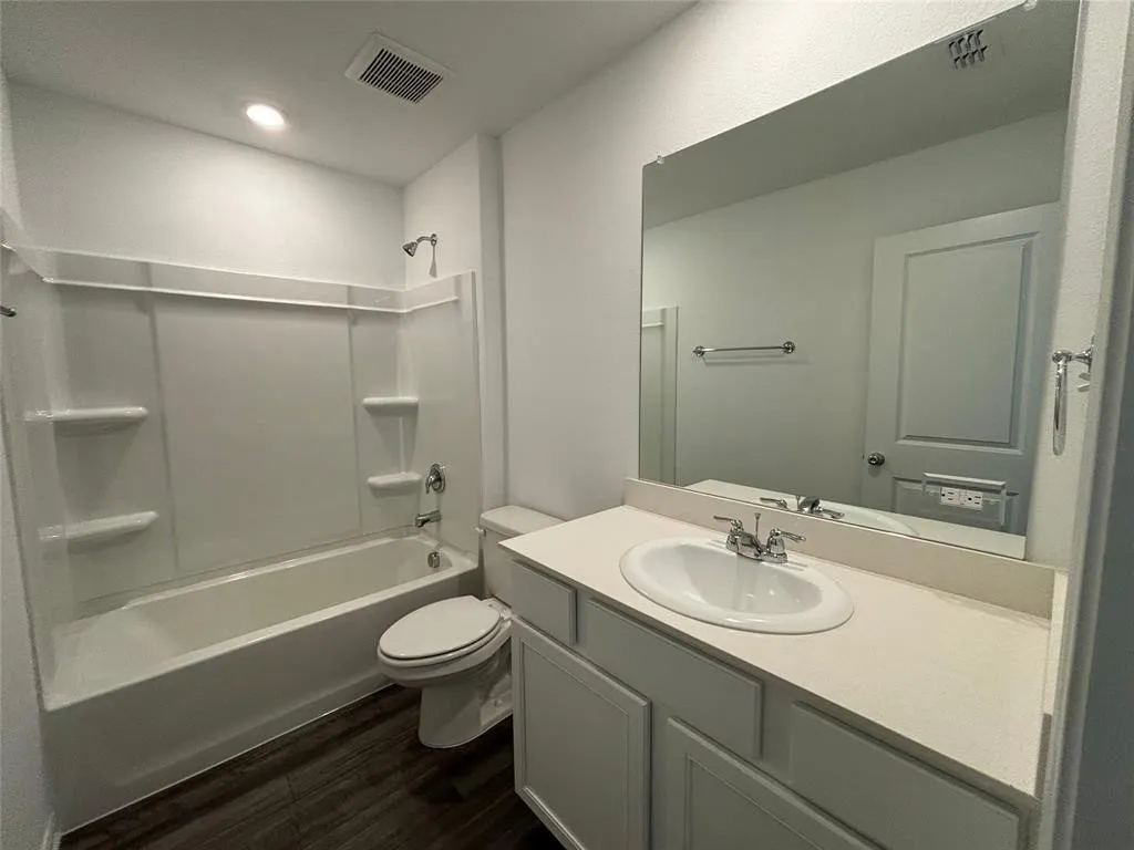 Full bath serving the 3 separate bedrooms