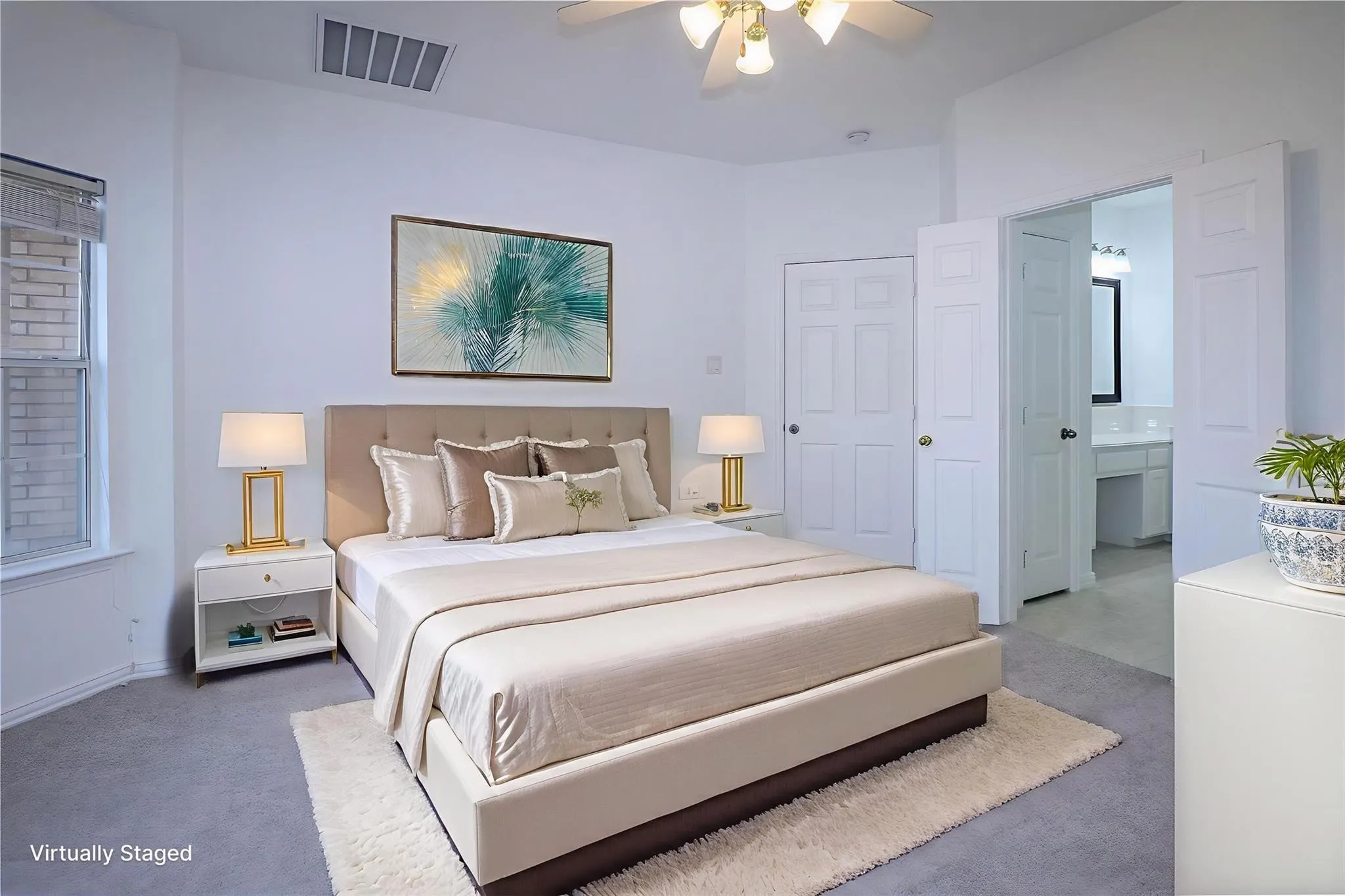 Neutral-toned wall-to-wall carpeting, ceiling-mounted light fixture with multi-blade fan, and six-panel interior doors