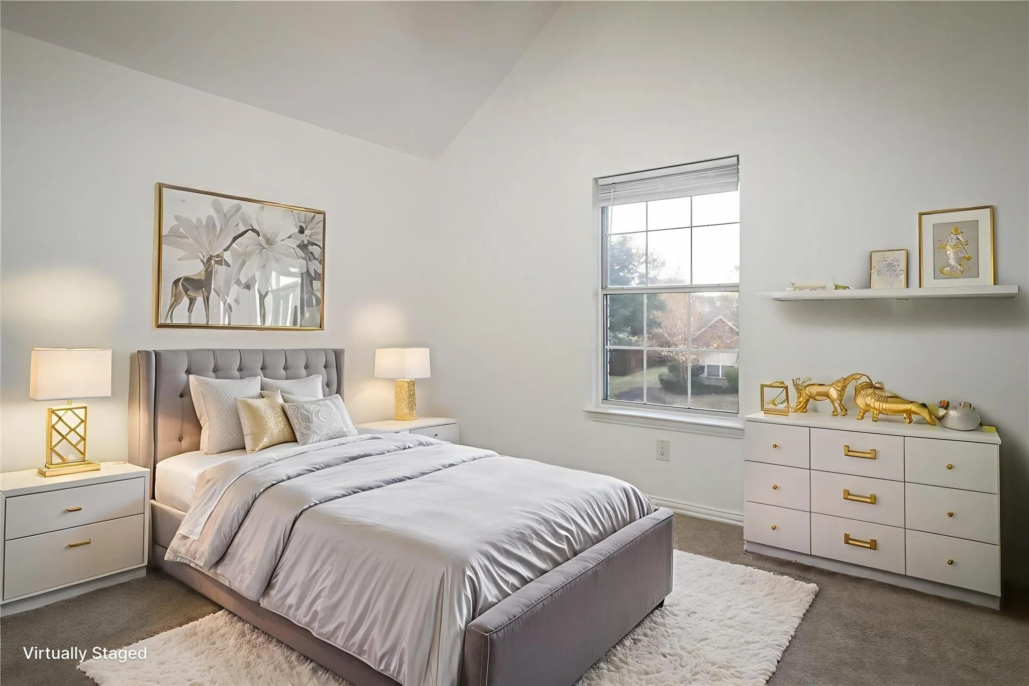 Vaulted ceiling, neutral wall color, single-pane window with white trim, and wall-mounted shelving