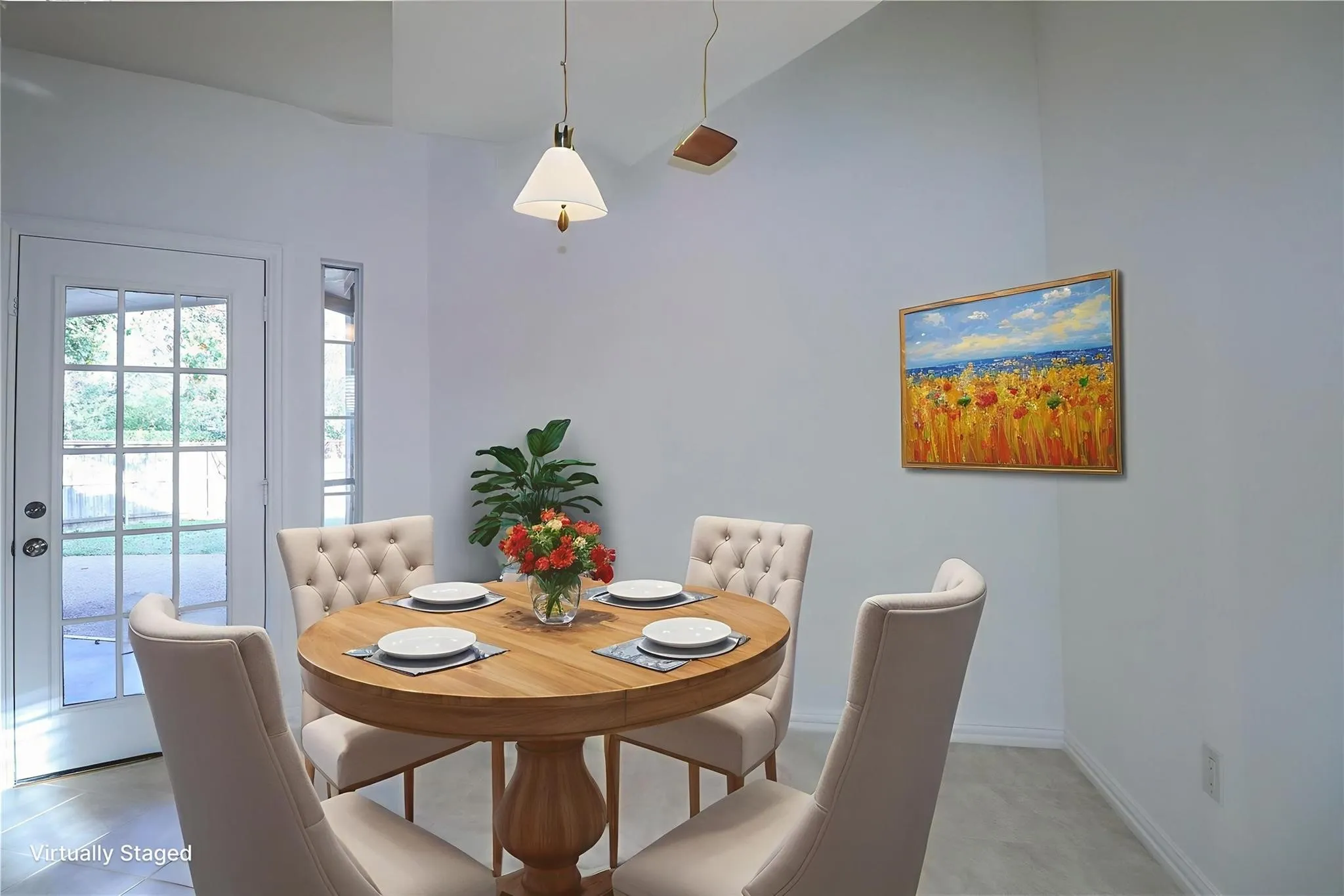 Vaulted ceiling, neutral wall tones, ceramic tile flooring, multi-pane glass door, and hanging pendant light fixture