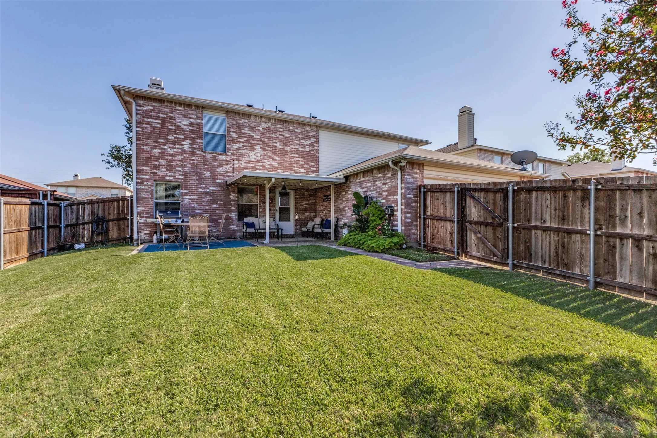 Beautiful backyard with wood privacy fence