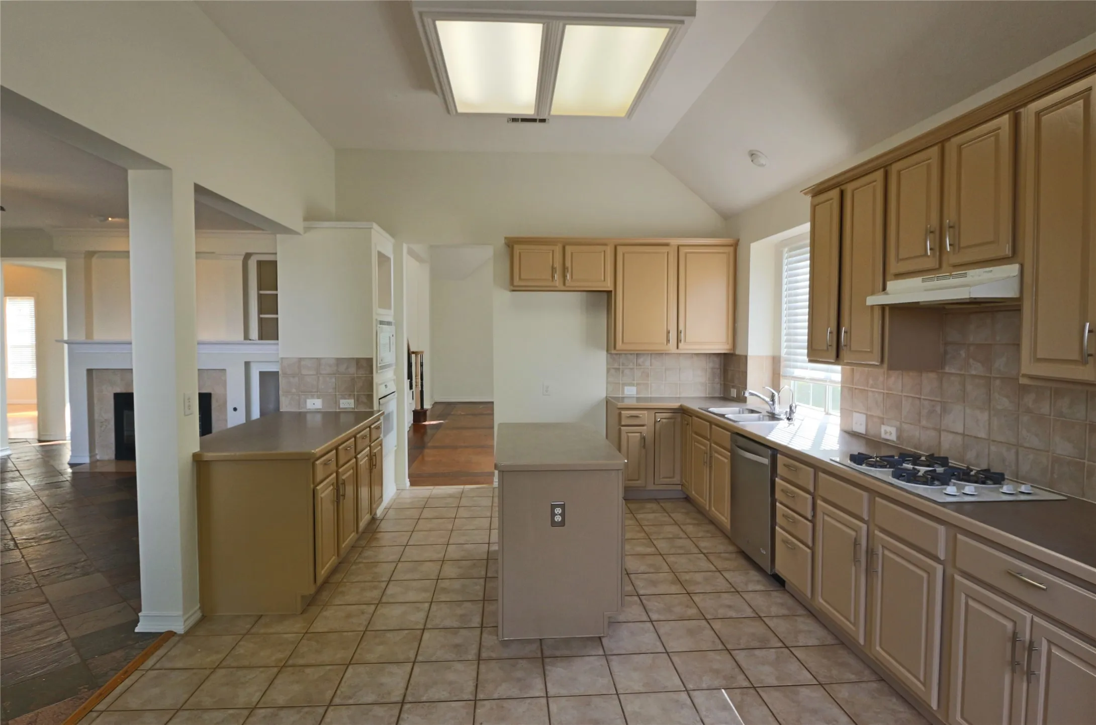 View of kitchen and living room from the breakfast area.