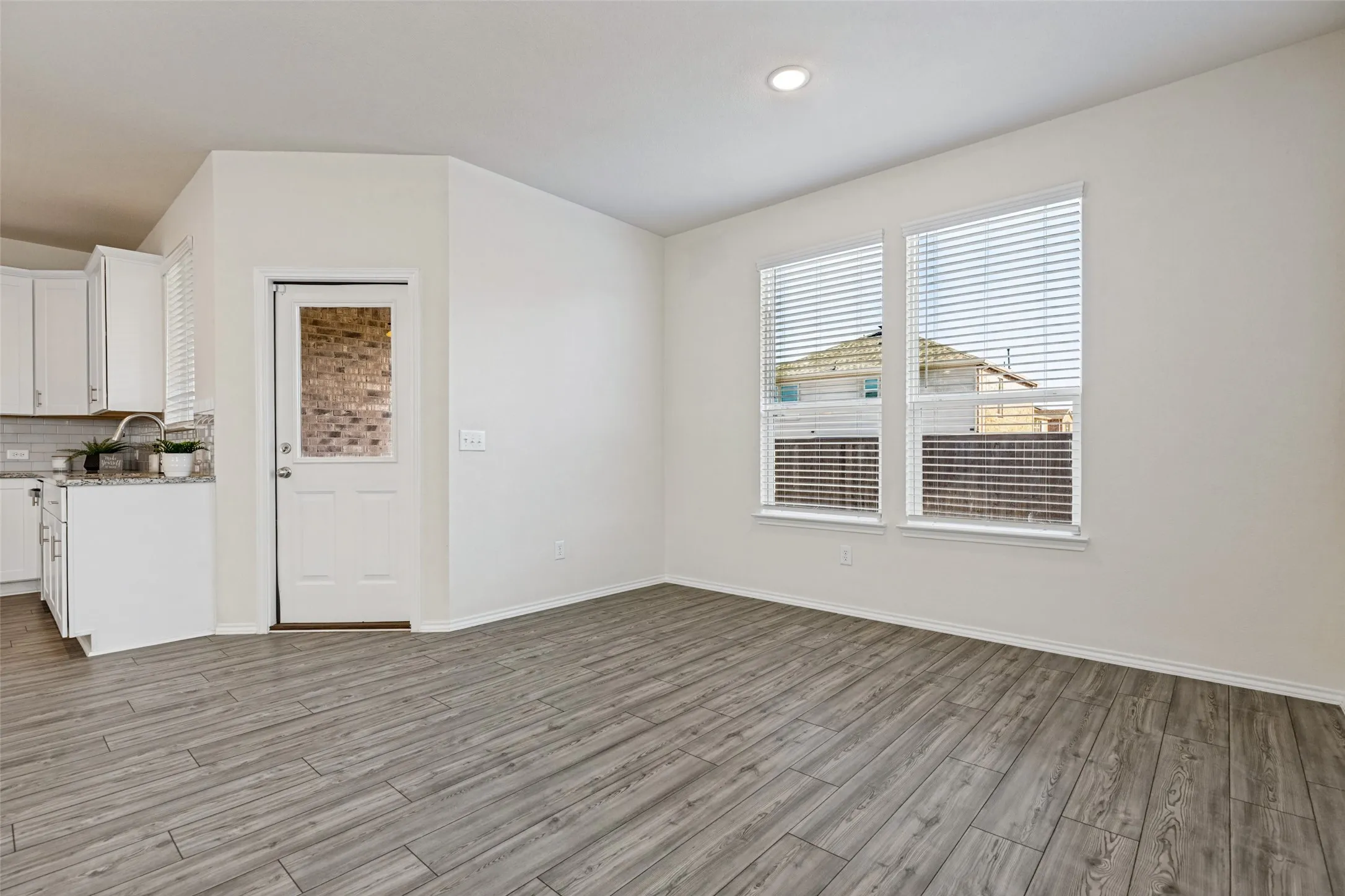 Dining area that overlooks the backyard and covered patio