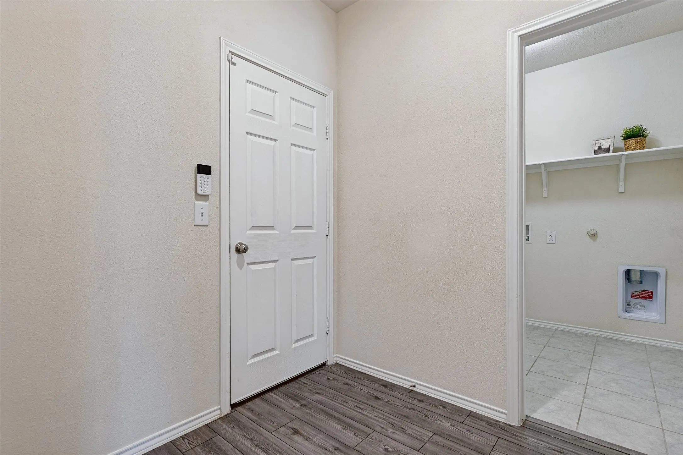 Large mud room off garage entry has plenty of room for storage needs