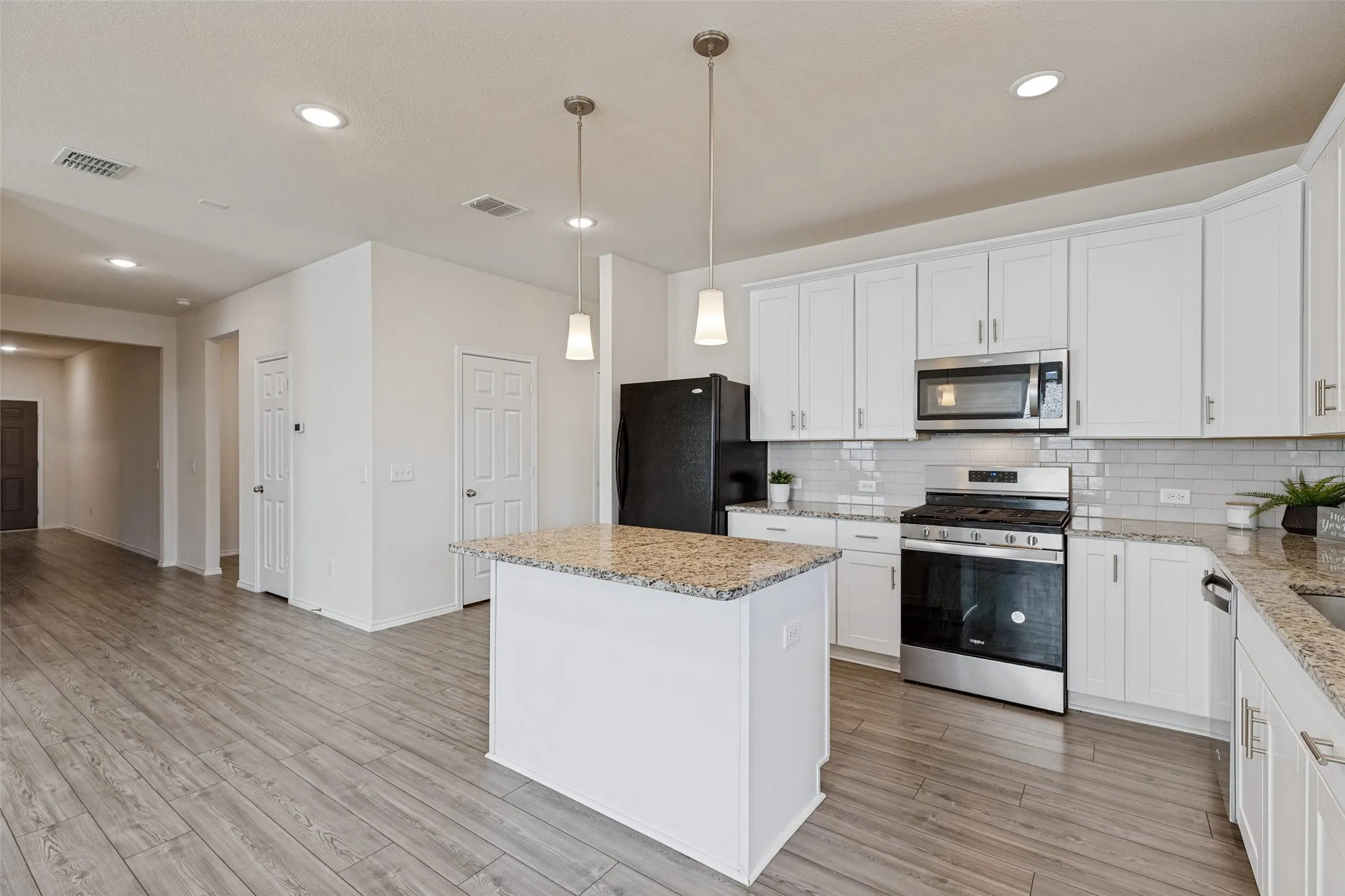 Notice the wide hallway which gives this home a very open feeling