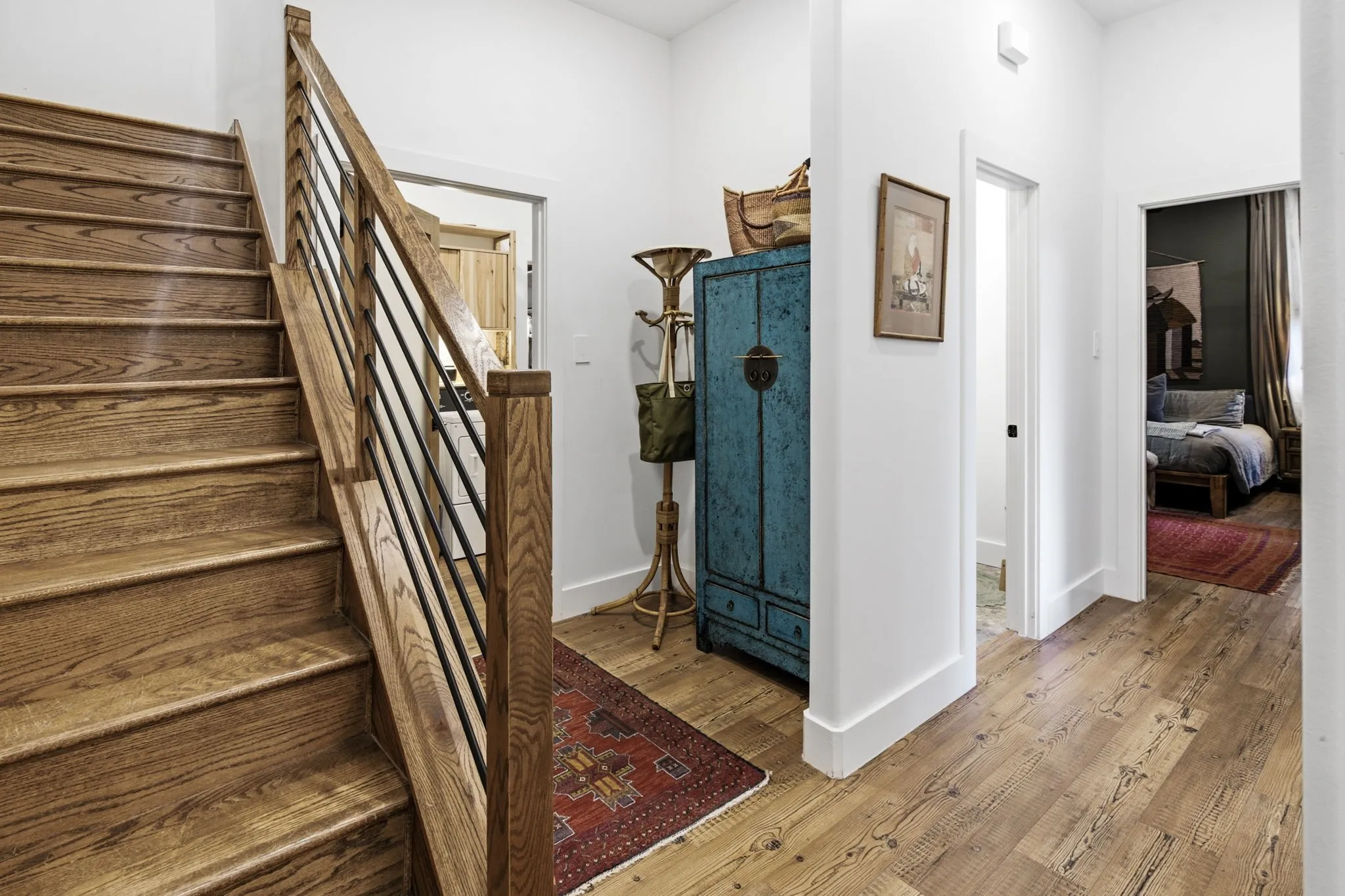 Hallway with stairs and half bath