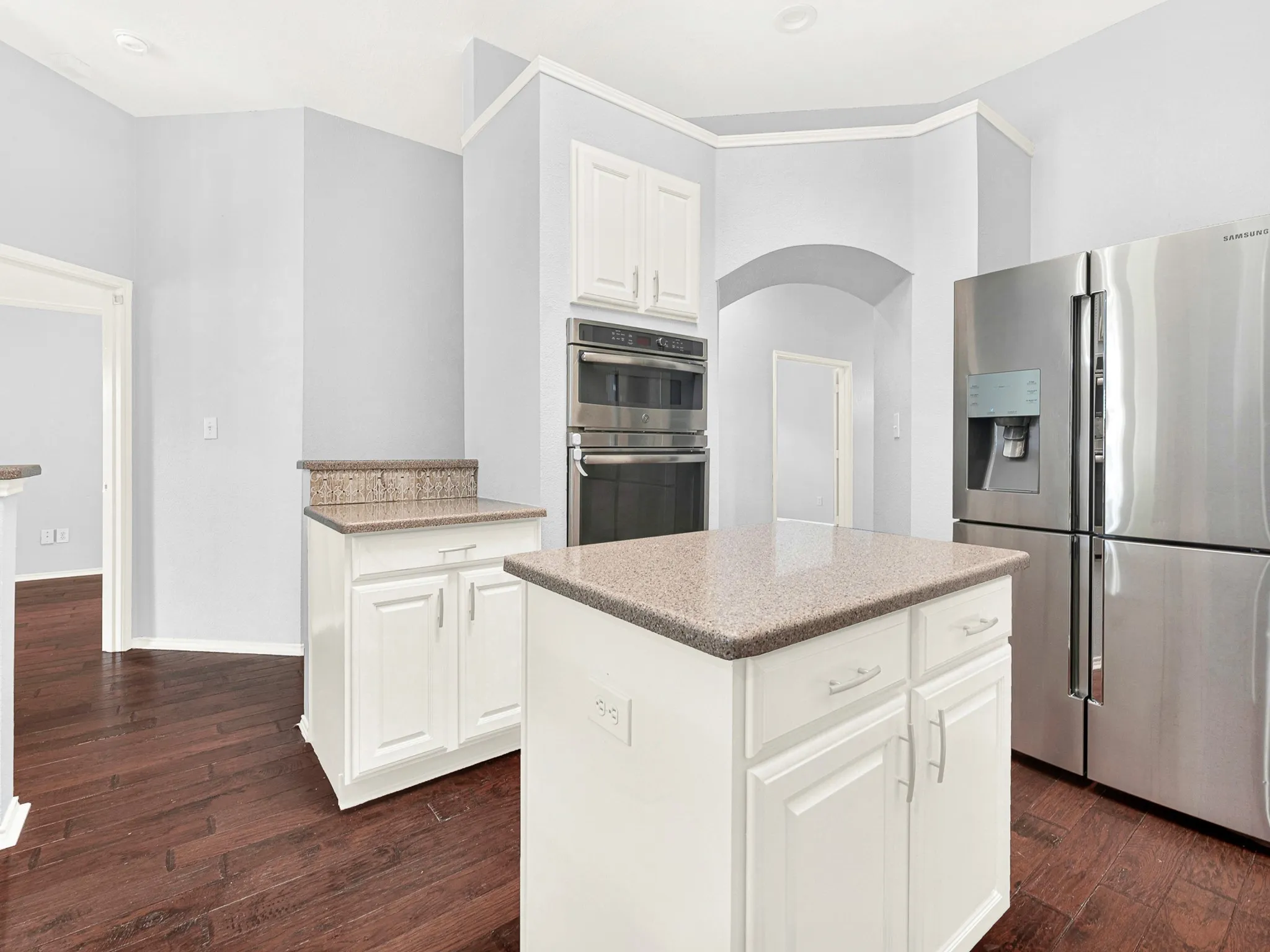 Granite countertops, stainless steel appliances, and center island