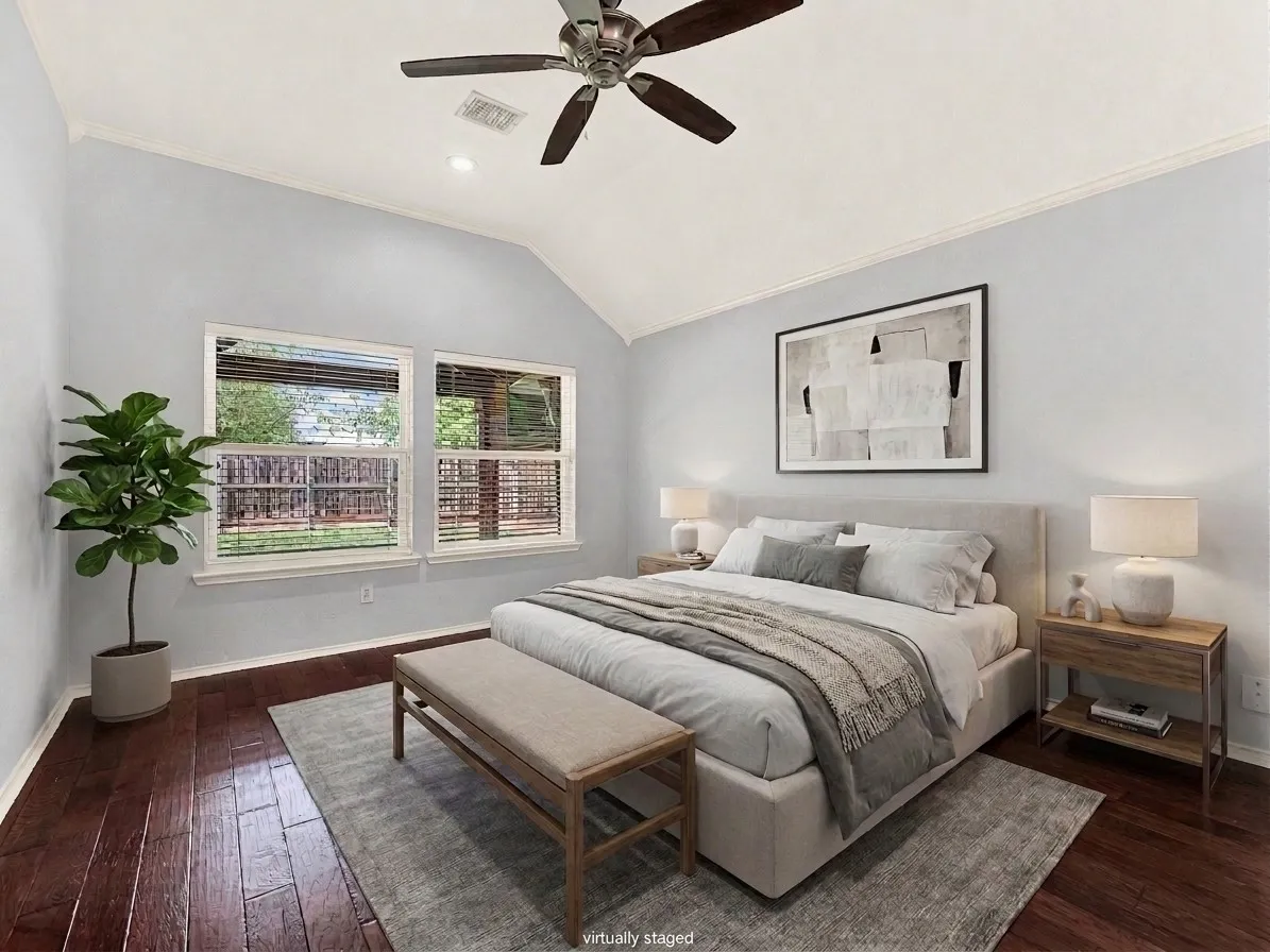 Primary bedroom overlooks backyard