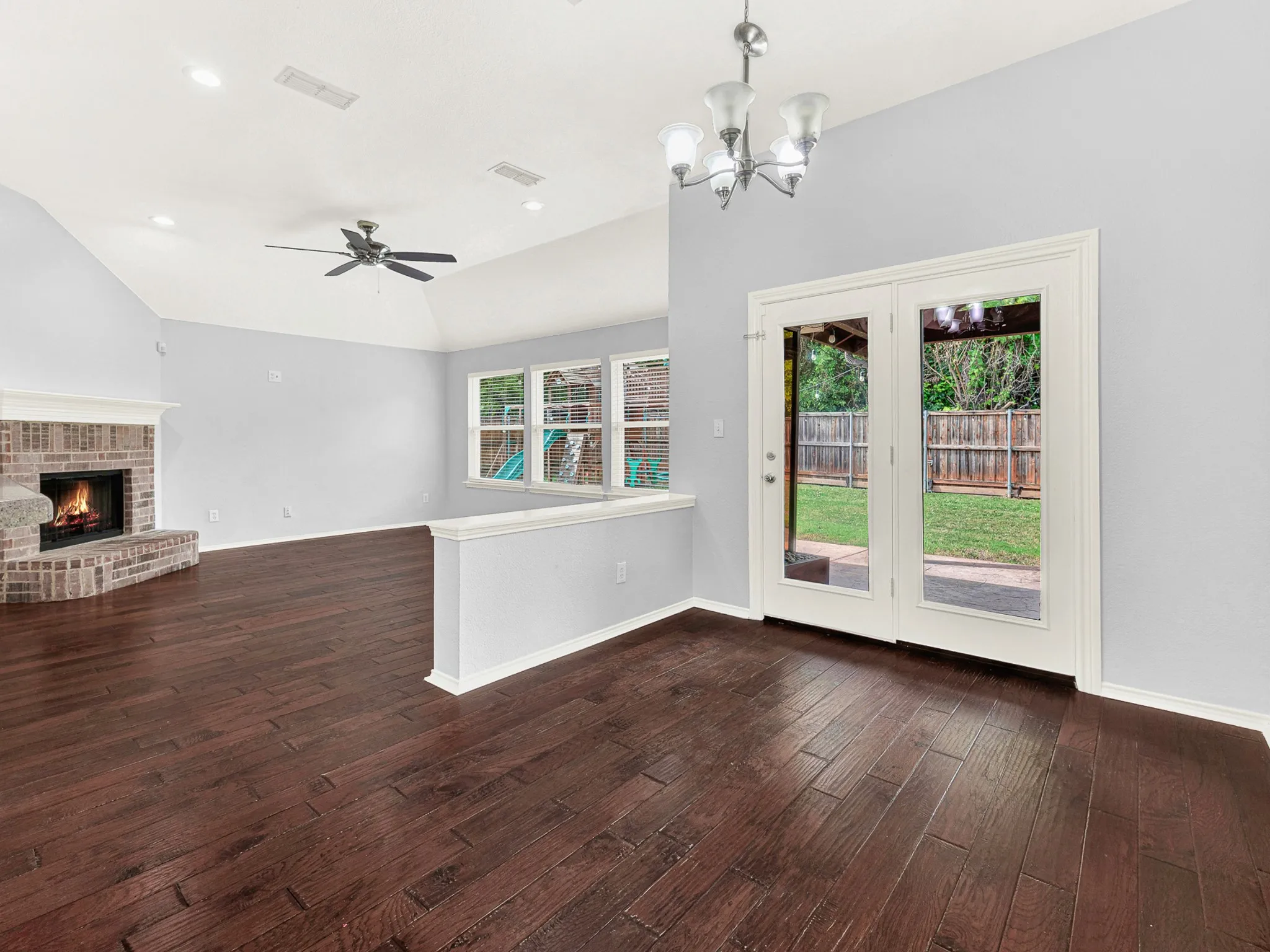 Second dining area and living room with views of the backyard