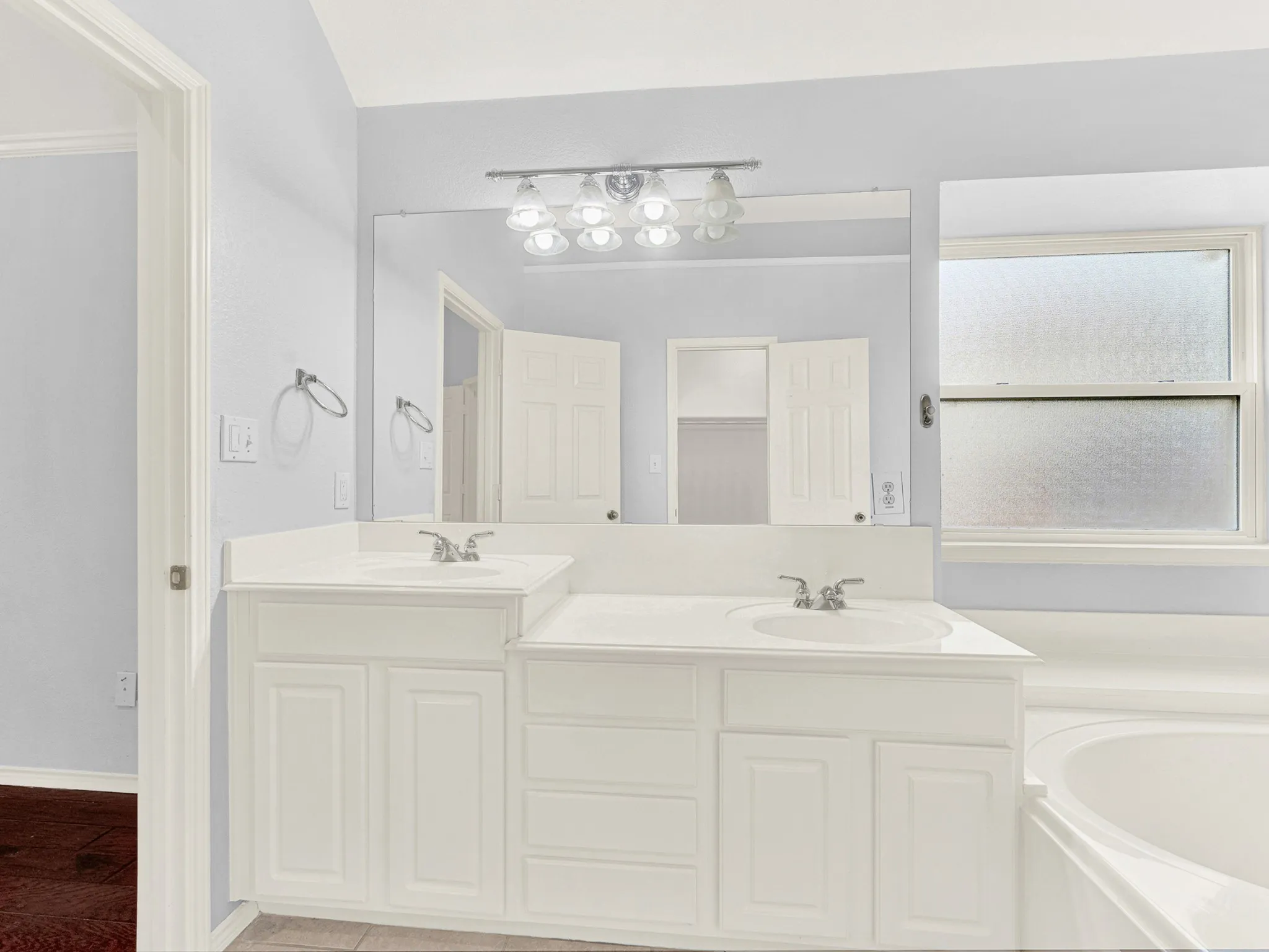 Clean white color palette with dual sinks