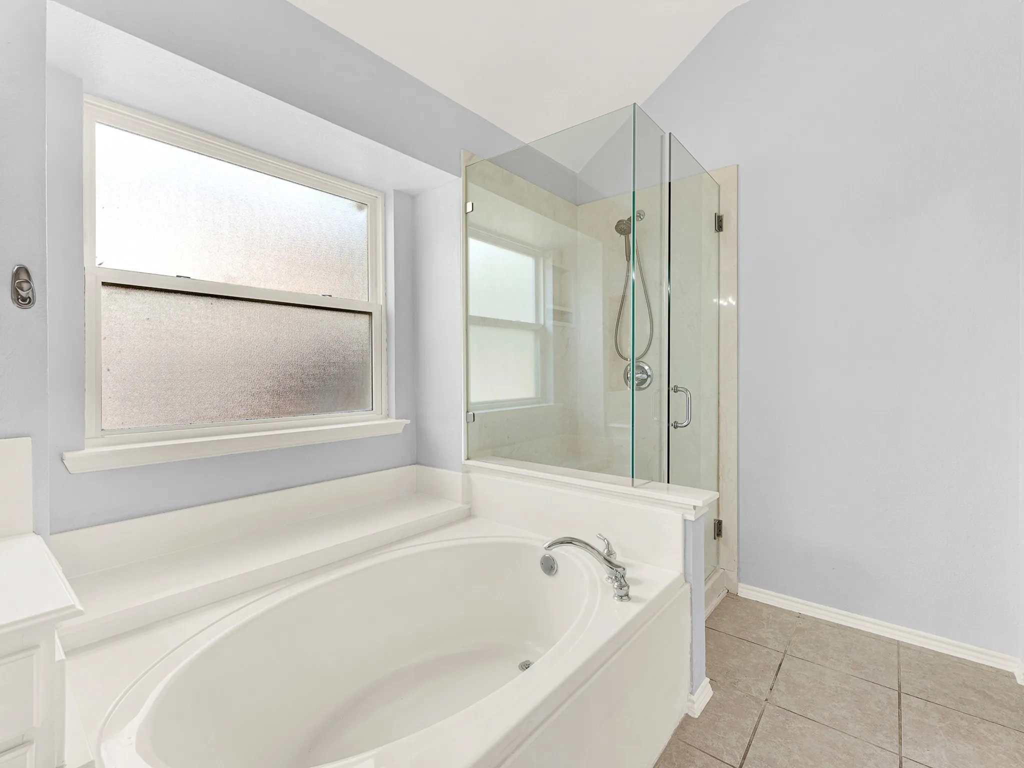 Separate tub and frameless walk-in shower