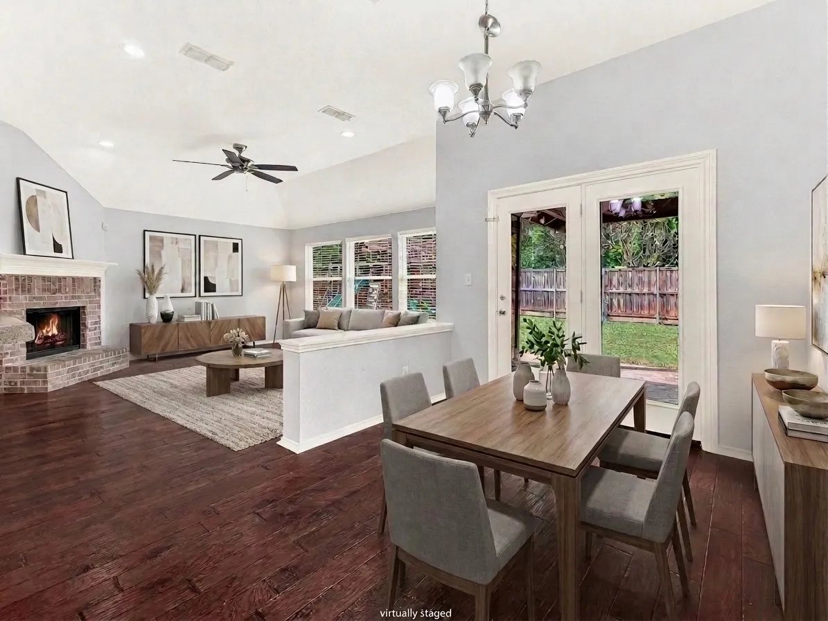Second dining area and living room with views of the backyard