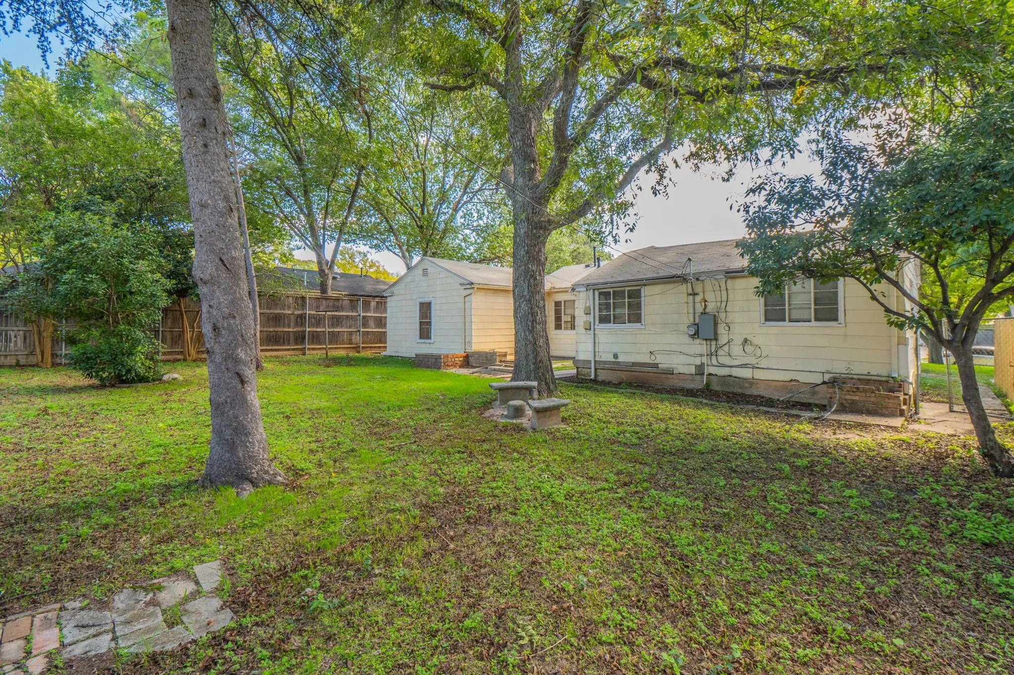 Large yard with mature trees