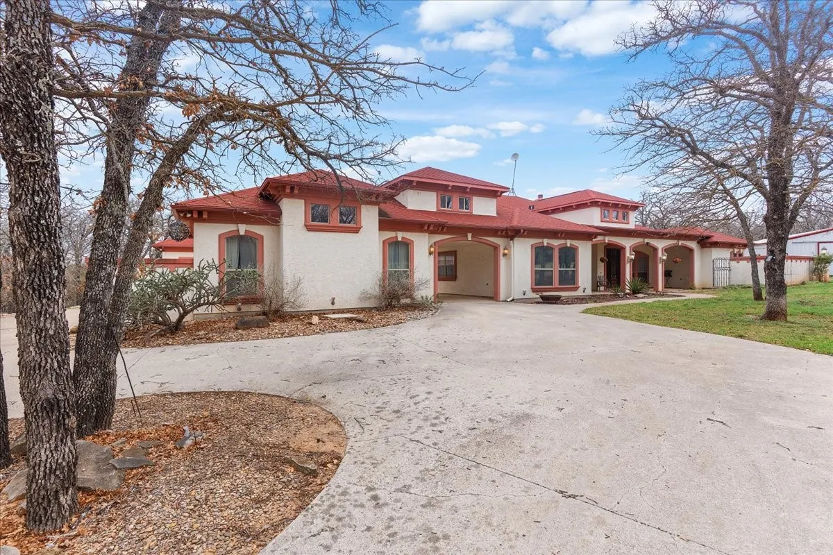 Stucco exterior with a terra cotta tile roof
