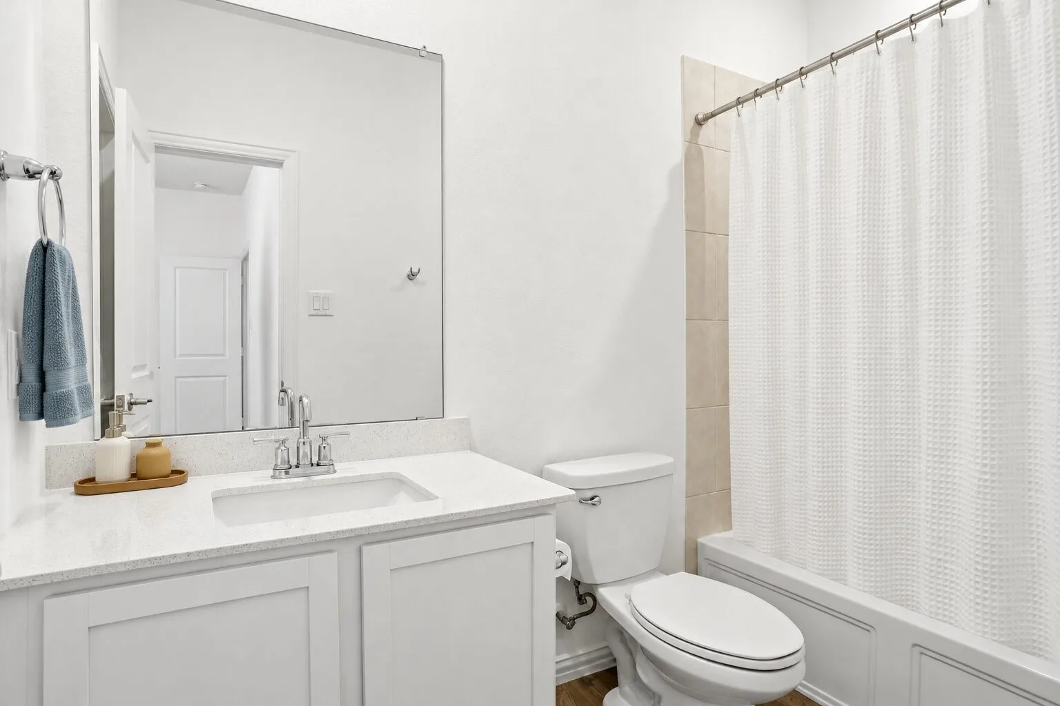 En suite bathroom to secondary bedroom; Photo has been digitally enhanced and/or virtually staged using AI.