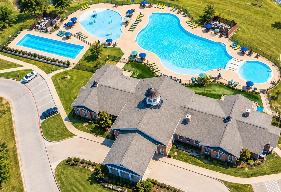 Community building with a cupola, two distinct swimming pools, an adjacent spa, and a separate rectangular lap pool