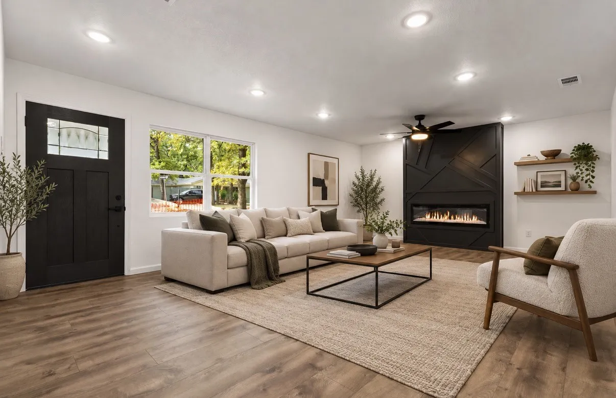 Living area featuring wood-finish flooring, recessed lighting, a fireplace with a geometric accent wall, a multi-pane entry door, and built-in wall shelving virtually staged