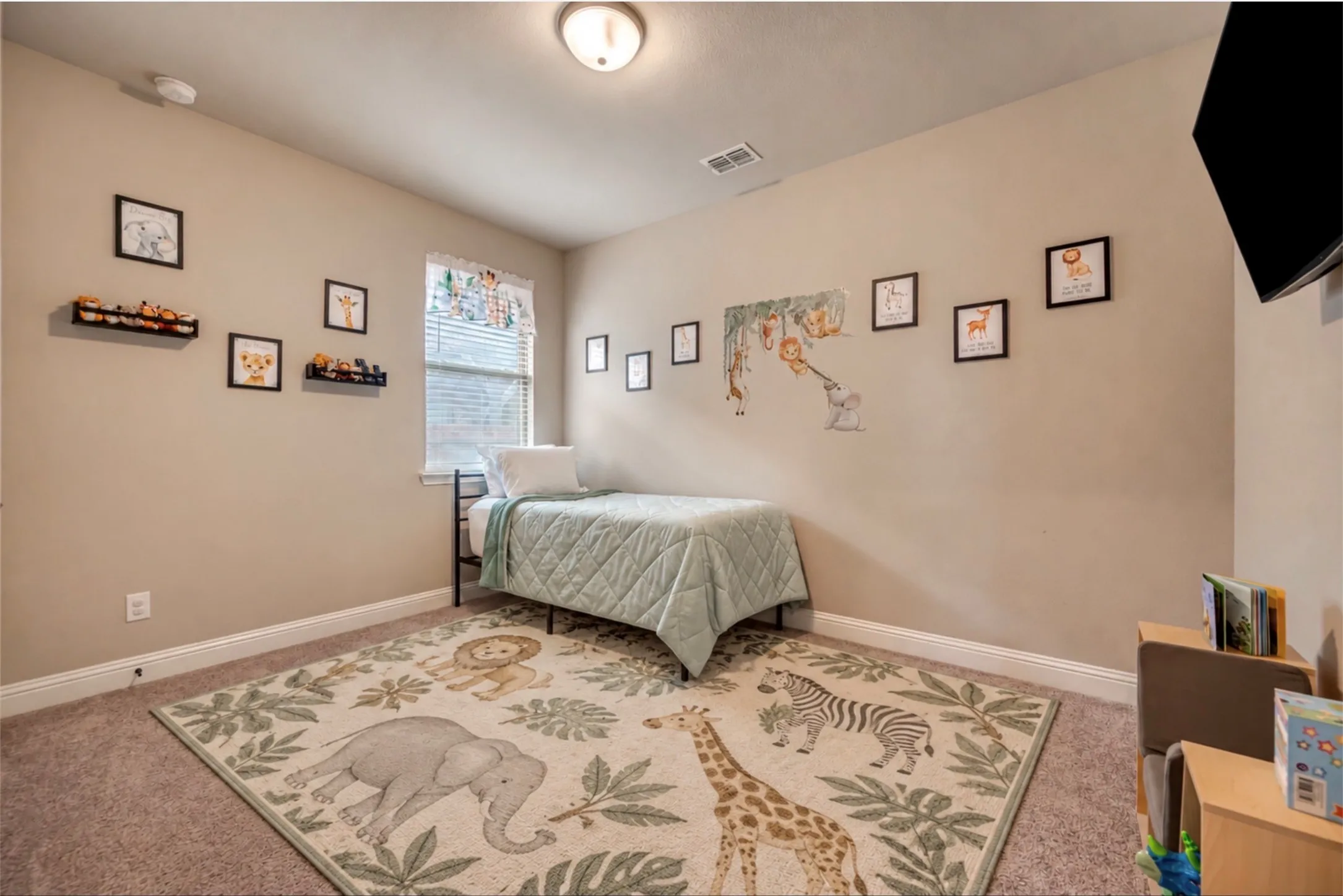 Neutral-toned interior space featuring wall-to-wall carpeting and a single window with blinds
