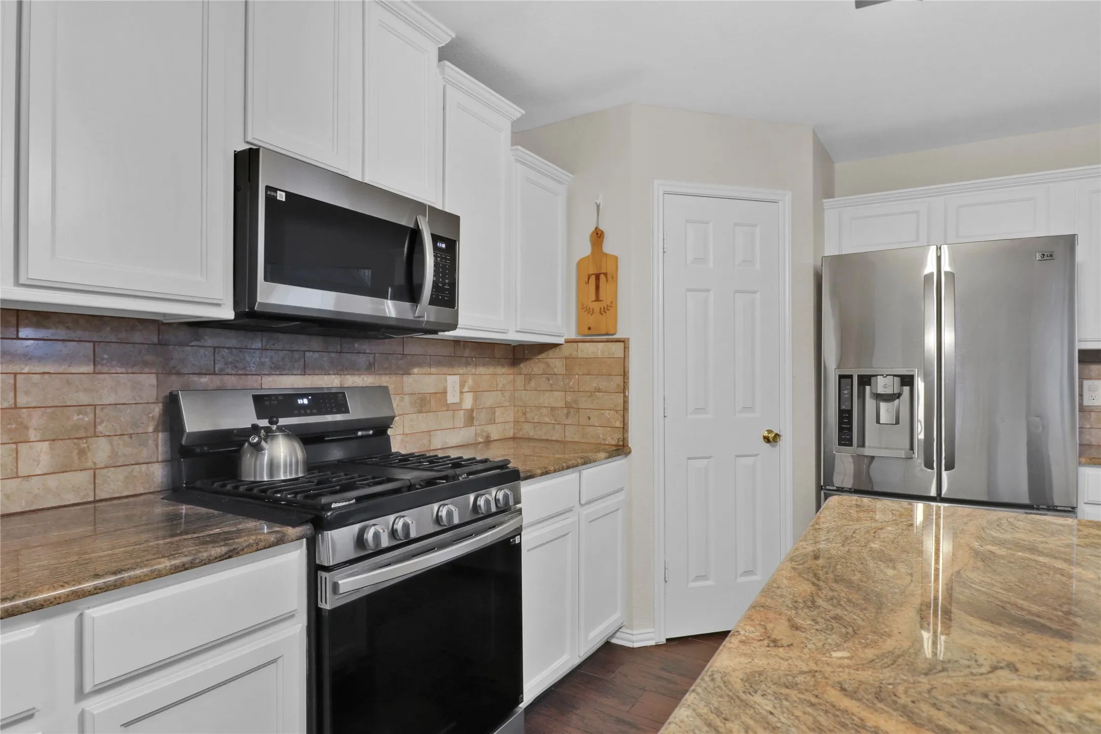 Gas range and microwave.