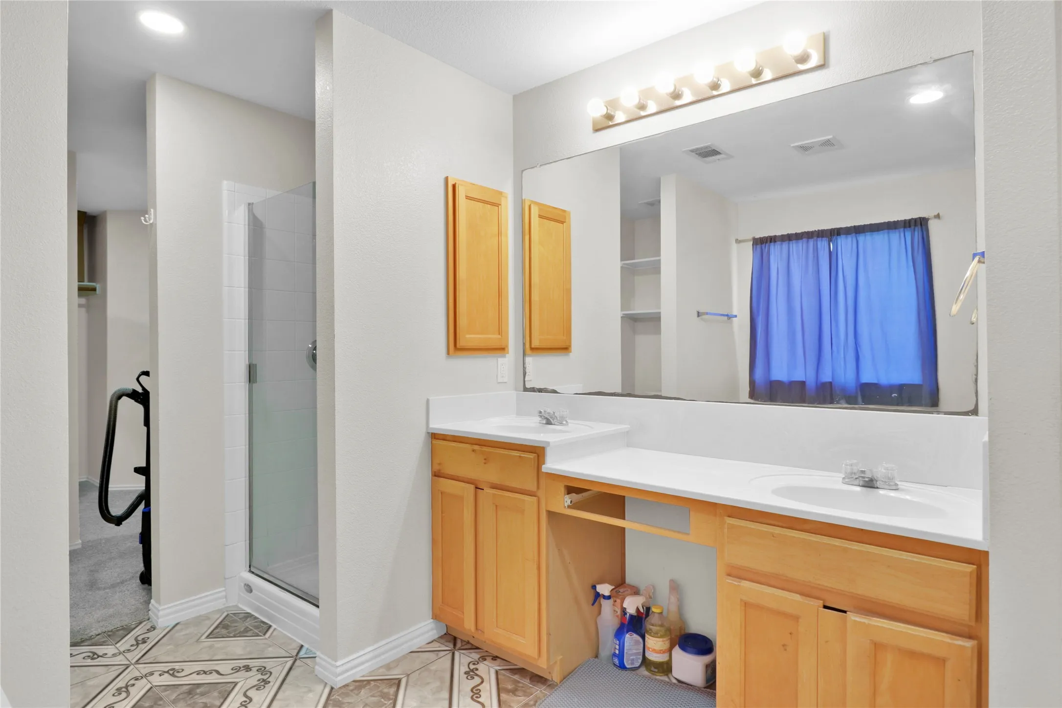 Master bath with separate shower and dual sinks.