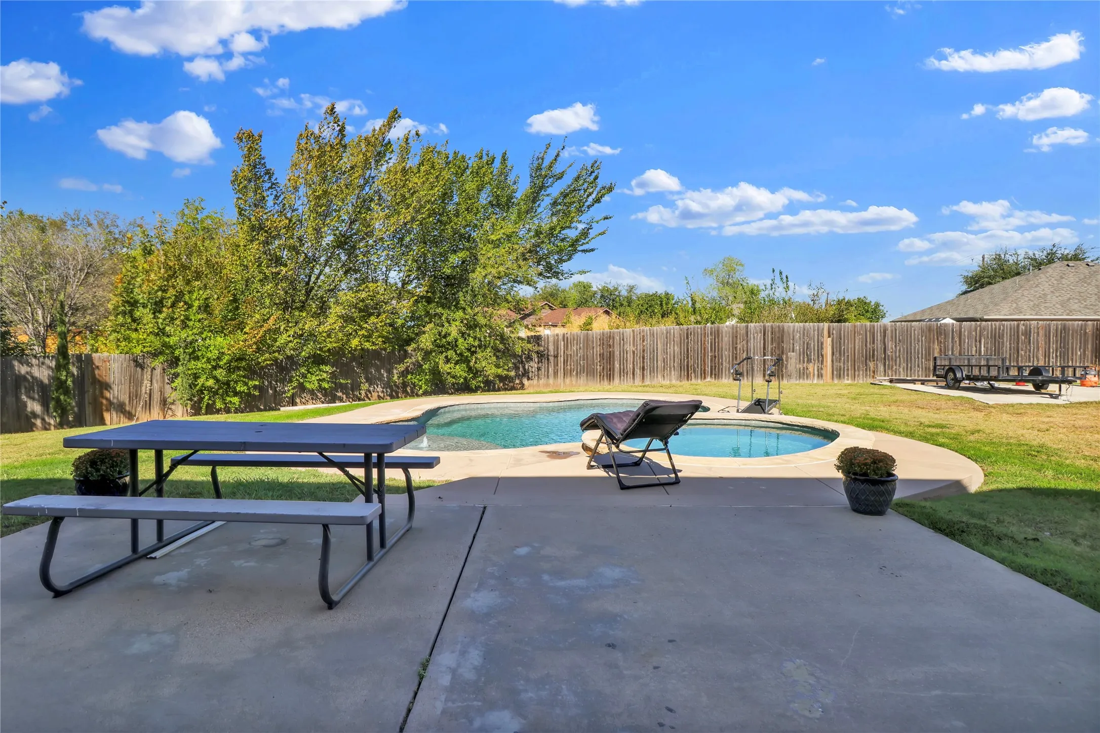Large back yard with pool and spa. Notice the parking space for boat, trailer or RV.