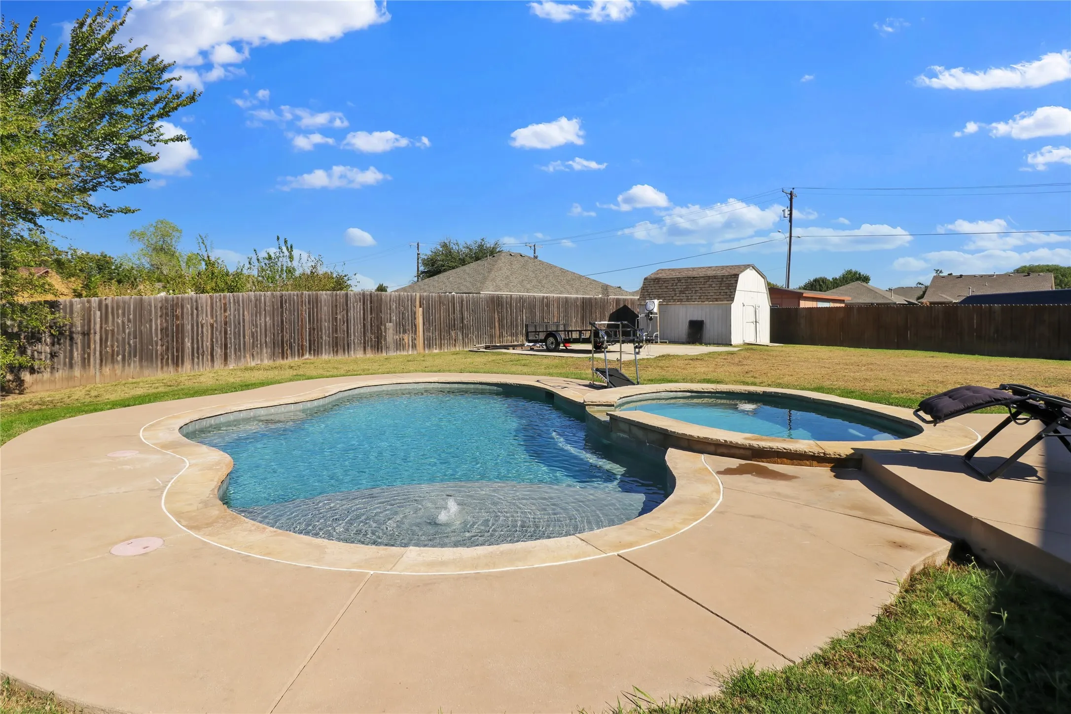 Pool and view of storage building.